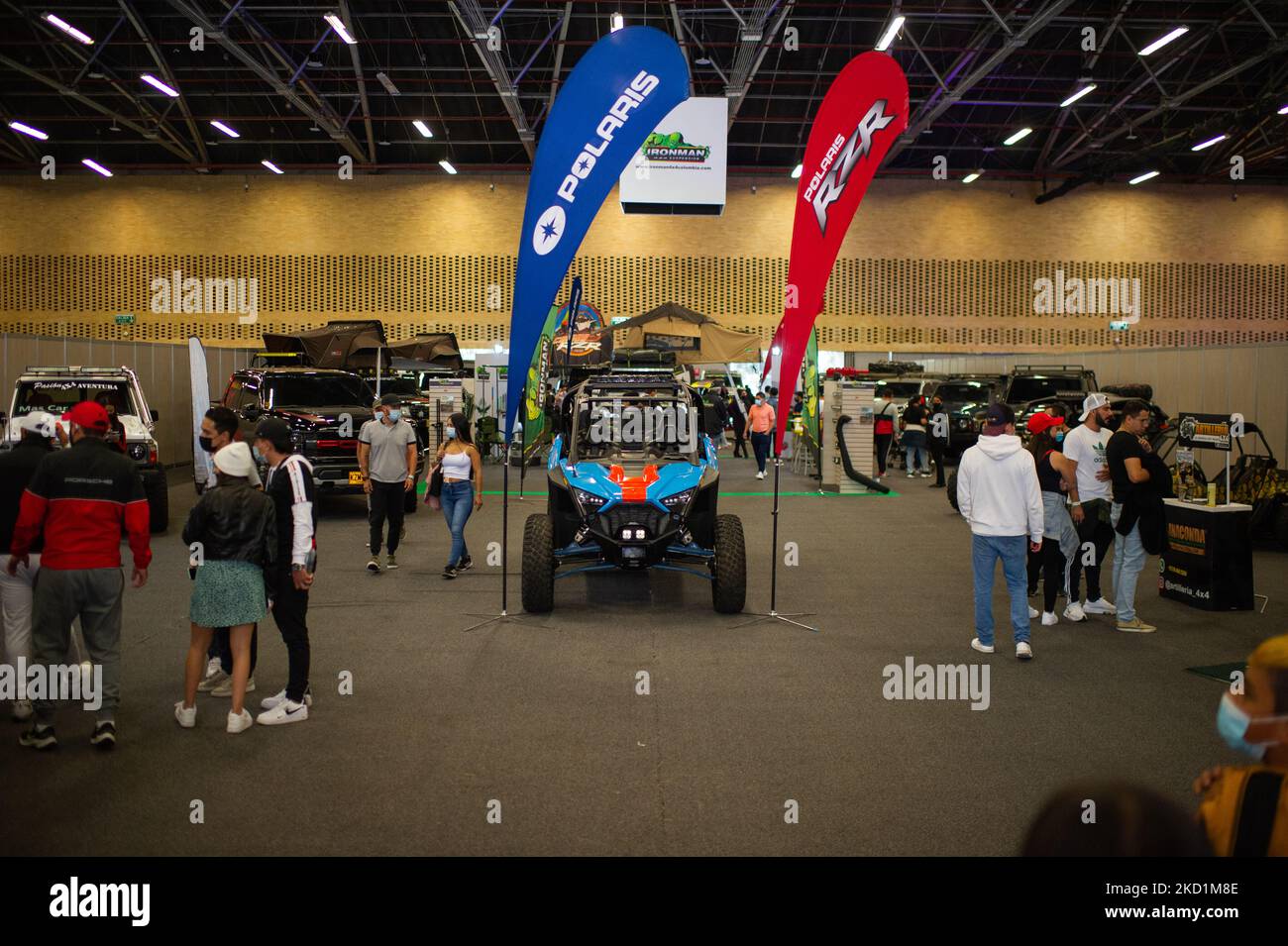 Car fans take photos with cars as they check them during the MCM Show