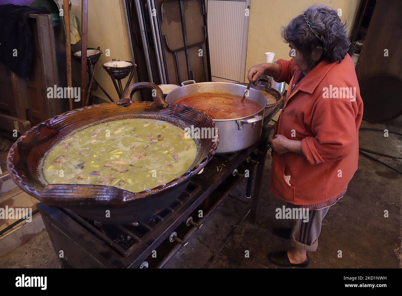 A woman prepares different stews for the preparation of tamales in San Francisco Culhuacán in Mexico City, on the occasion of Candlemas Day, which celebrates the period that closes the cycle of Christmas festivities within the Catholic Church. The tamale (from the Nahuatl tamalli, which means wrapped) is a Mexican food made from corn, filled with various ingredients, cooked in a bundle of vegetable leaves that can be made of corn, plantain, reed, chilaca or papatla. (Photo by Gerardo Vieyra/NurPhoto) Stock Photo