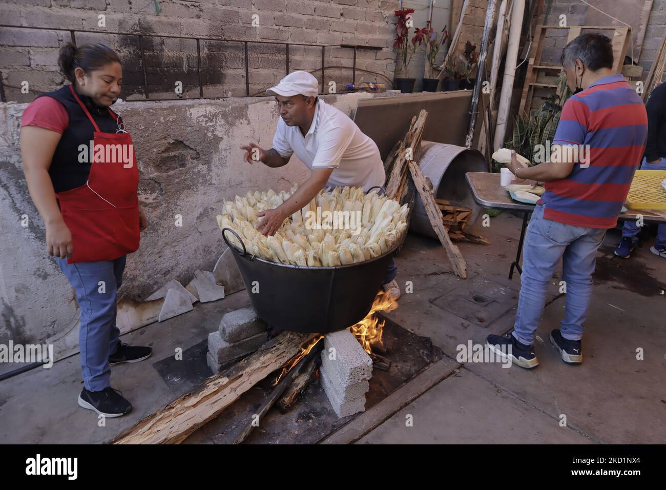 Inhabitants of San Francisco Culhuacán in Mexico City place tamales in a pot to be cooked on the occasion of Candlemas Day, which celebrates the period that closes the cycle of Christmas festivities within the Catholic Church. The tamale (from the Nahuatl tamalli, which means wrapped) is a Mexican food made from corn, filled with various ingredients, cooked in a bundle of vegetable leaves that can be made of corn, plantain, reed, chilaca or papatla. (Photo by Gerardo Vieyra/NurPhoto) Stock Photo