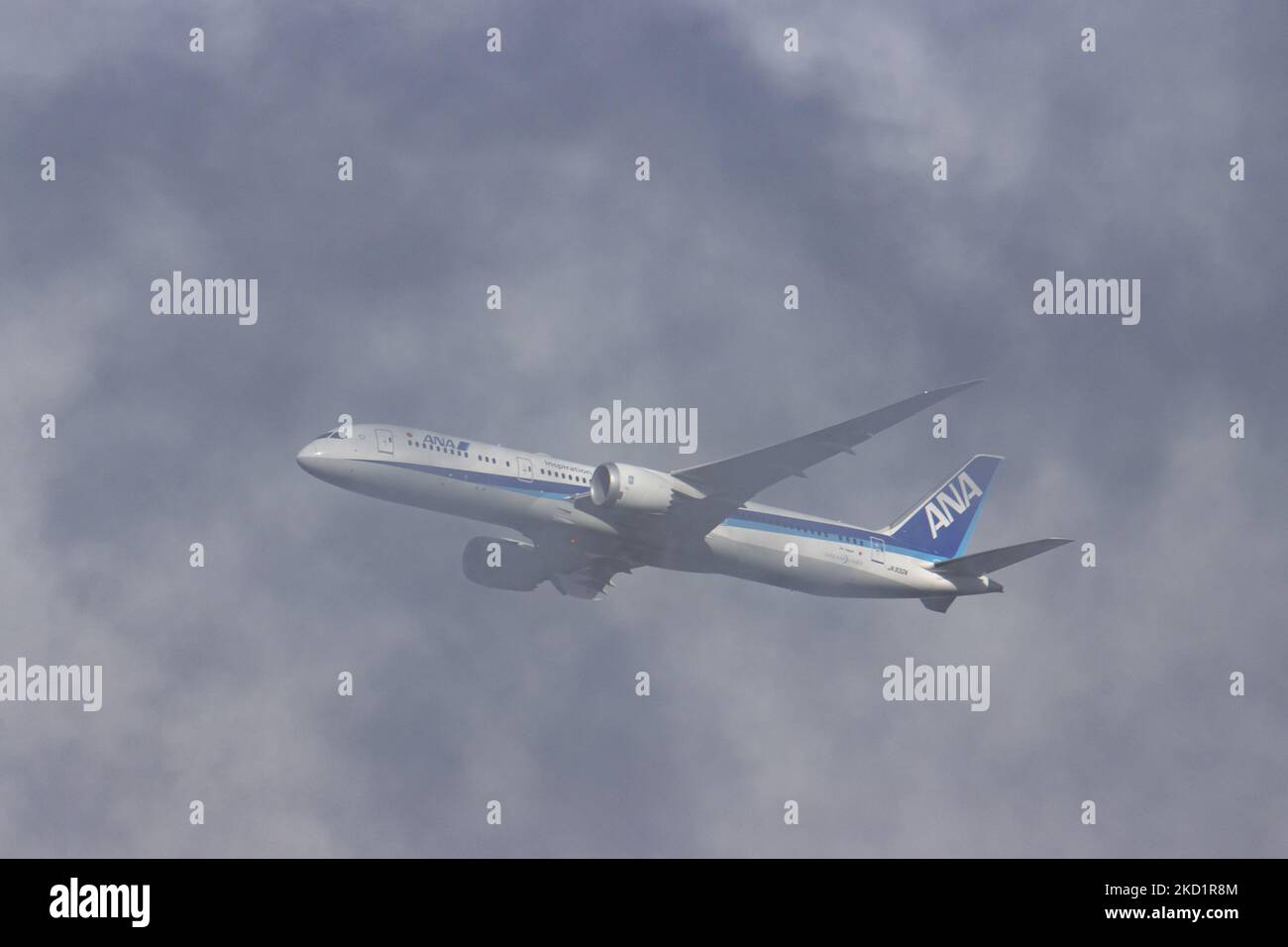 The aircraft as seen in some low clouds during the go around. ANA All Nippon Airways Boeing 787 Dreamliner aircraft as seen on final approach flying, doing a go around and then landing at Brussels Airport Zaventem BRU. The arriving from Tokyo passenger plane, a Boeing B787-9 wide body airplane of ANA Air Japan has the registration JA932A. The Japanese airline is member of Star Alliance aviation group with a fleet of 214 jet planes. The aviation industry and passenger traffic are phasing a difficult period with the Covid-19 coronavirus pandemic having a negative impact on the travel business in Stock Photo