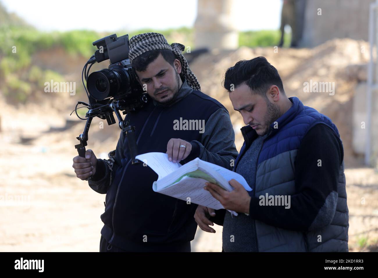 Palestinian actors and crew shoot a scene of the series by local Al-Aqsa TV 'Qabdat al-Ahrar,' meaning 'Fist of the Free' in Arabic, in Gaza city on February 3, 2022. - In the Hamas-ruled Gaza Strip, an impoverished Palestinian territory with scant resources for entertainment, a crew from Al-Aqsa TV is shooting a 'pro-resistance' series aiming to present their side of the Israeli-Palestinian conflict, intended as a spin on the popular Israeli series 'Fauda', followed worldwide on streaming services such as Netflix, HBO, and Apple TV, yet largely regarded by Palestinians as Israeli propagnda. ( Stock Photo