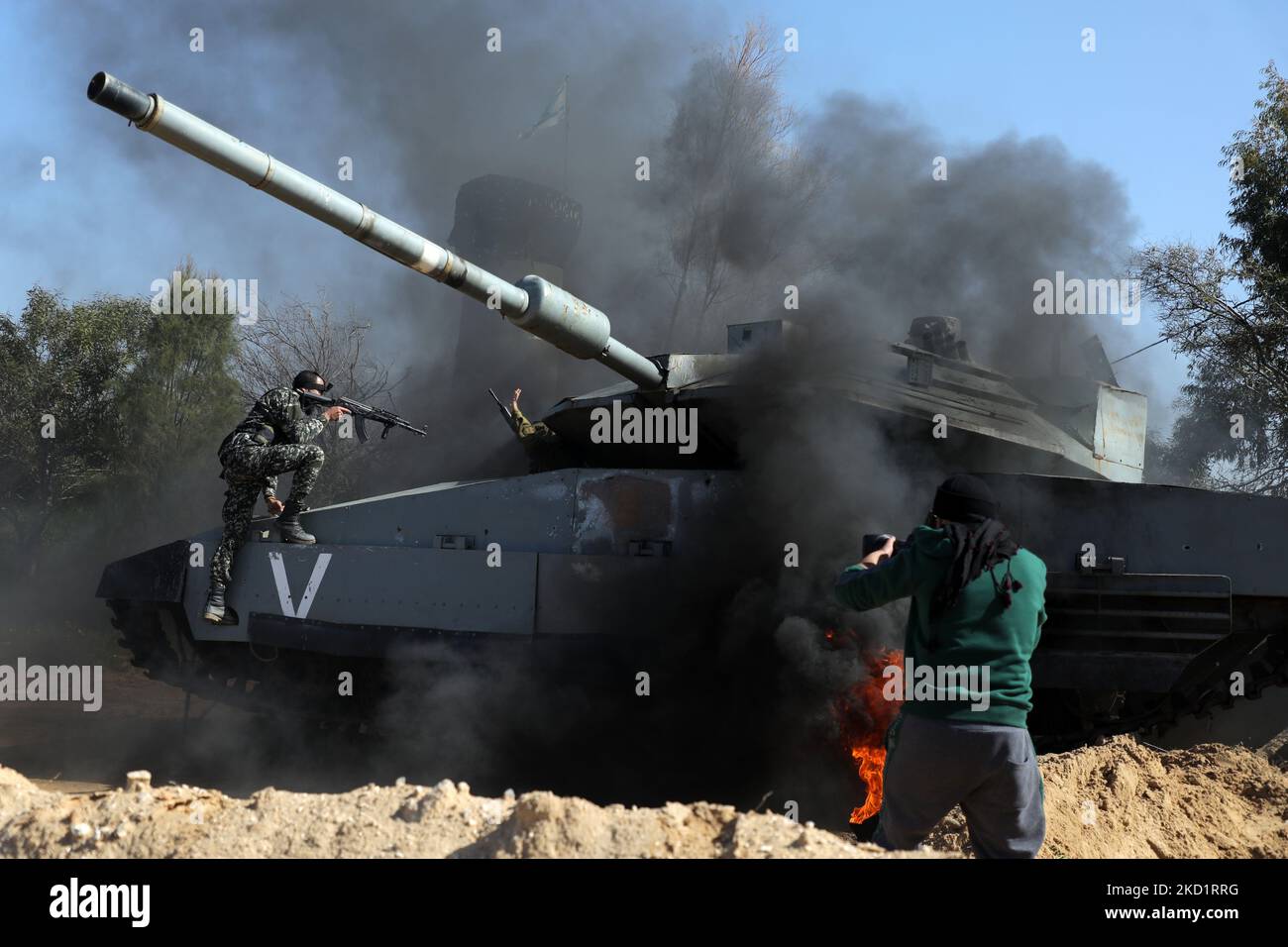 Palestinian actors and crew shoot a scene of the series by local Al-Aqsa TV 'Qabdat al-Ahrar,' meaning 'Fist of the Free' in Arabic, in Gaza city on February 3, 2022. - In the Hamas-ruled Gaza Strip, an impoverished Palestinian territory with scant resources for entertainment, a crew from Al-Aqsa TV is shooting a 'pro-resistance' series aiming to present their side of the Israeli-Palestinian conflict, intended as a spin on the popular Israeli series 'Fauda', followed worldwide on streaming services such as Netflix, HBO, and Apple TV, yet largely regarded by Palestinians as Israeli propagnda. ( Stock Photo