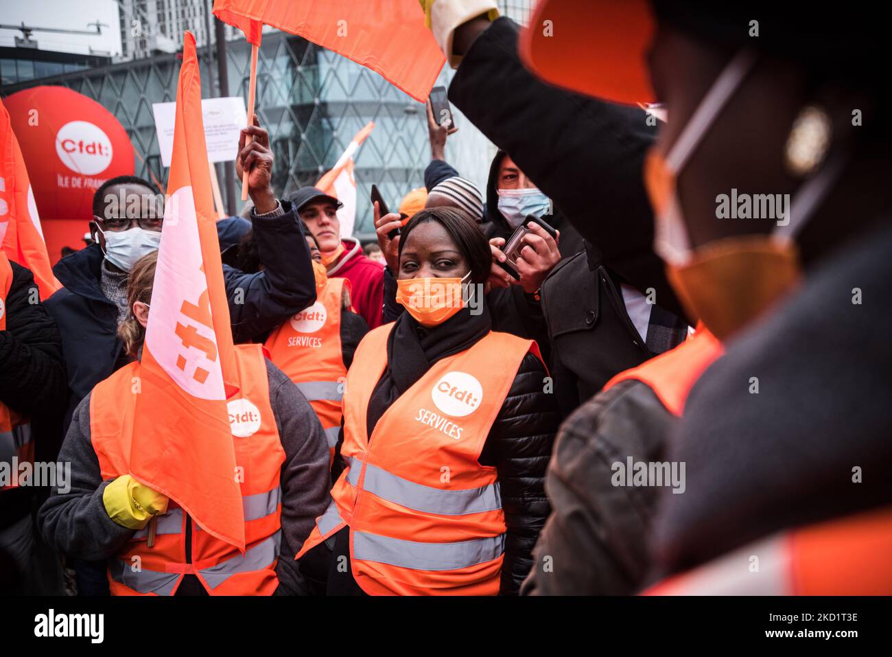 Several hundred activists from the CFDT (Confédération Française Des Travailleurs) union gathered in Paris in front of the Beaugrenelle shopping center on February 3, 2022 to participate in the March of Non-Essential Workers organized by the union to demand better wages and working conditions for those who were on the front lines during the COVID pandemic. (Photo by Samuel Boivin/NurPhoto) Stock Photo