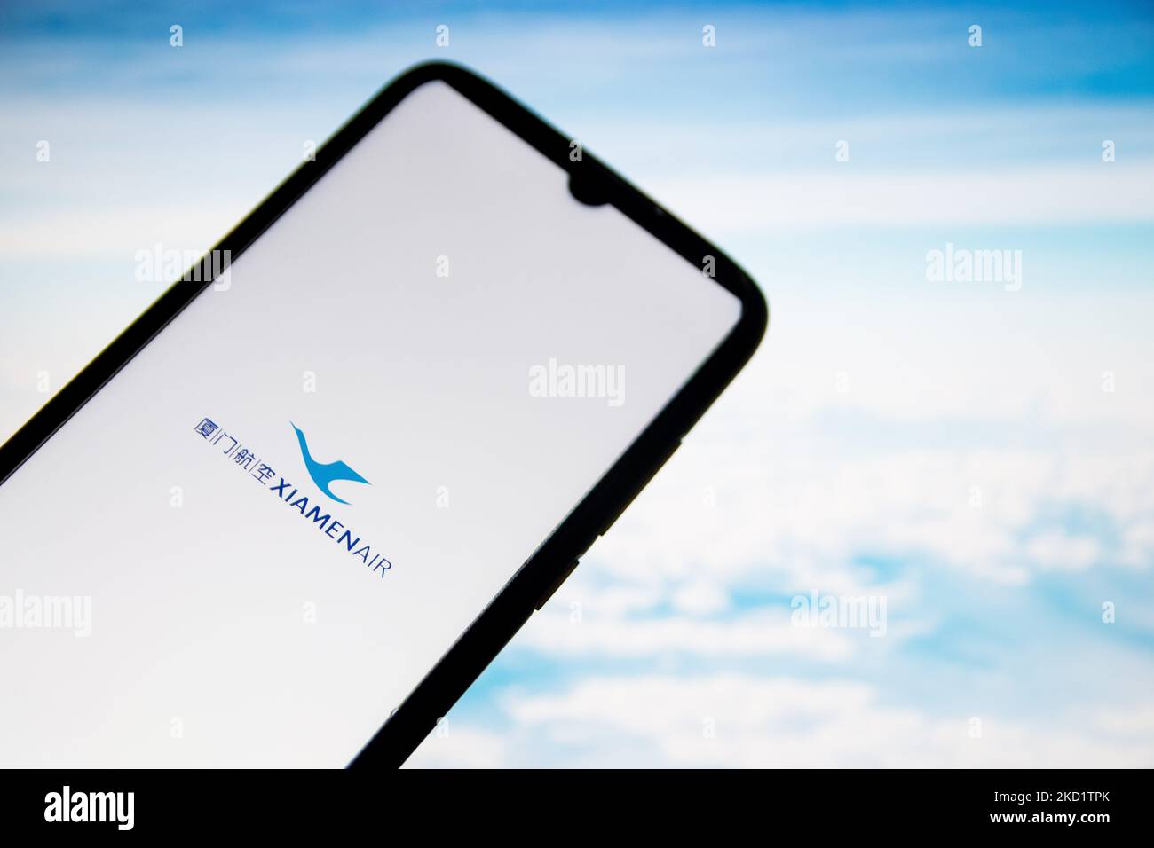 In this photo illustration a XiamenAir airlines logo seen displayed on a smartphone screen with a computer wallpaper in the background in Athens, Greece on February 4, 2022. (Photo Illustration by Nikolas Kokovlis/NurPhoto) Stock Photo