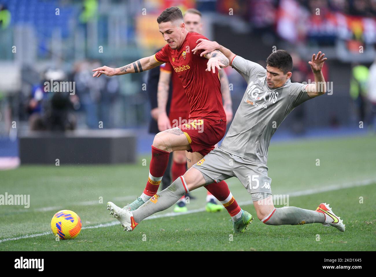 Johan Vasquez of Genoa CFC and Nicolò Zaniolo of AS Roma during football  Serie A Match at Stadio Olimpico, As Roma v Genoa on February 5, 2022 in  Rome, Italy. (Photo by