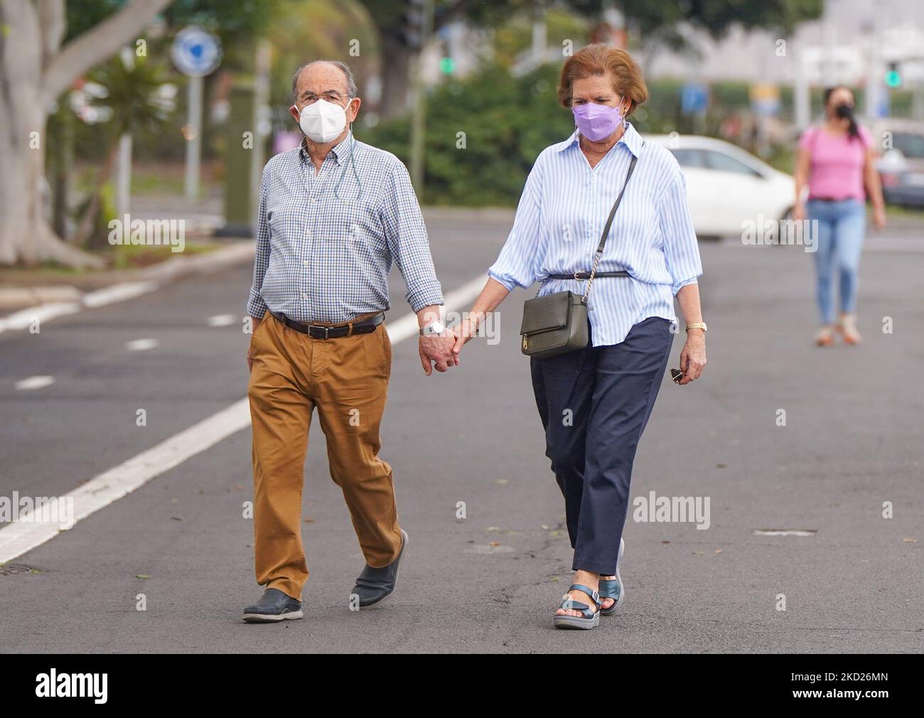People wearing face masks walk in Santa Cruz de tenerife on 8 february