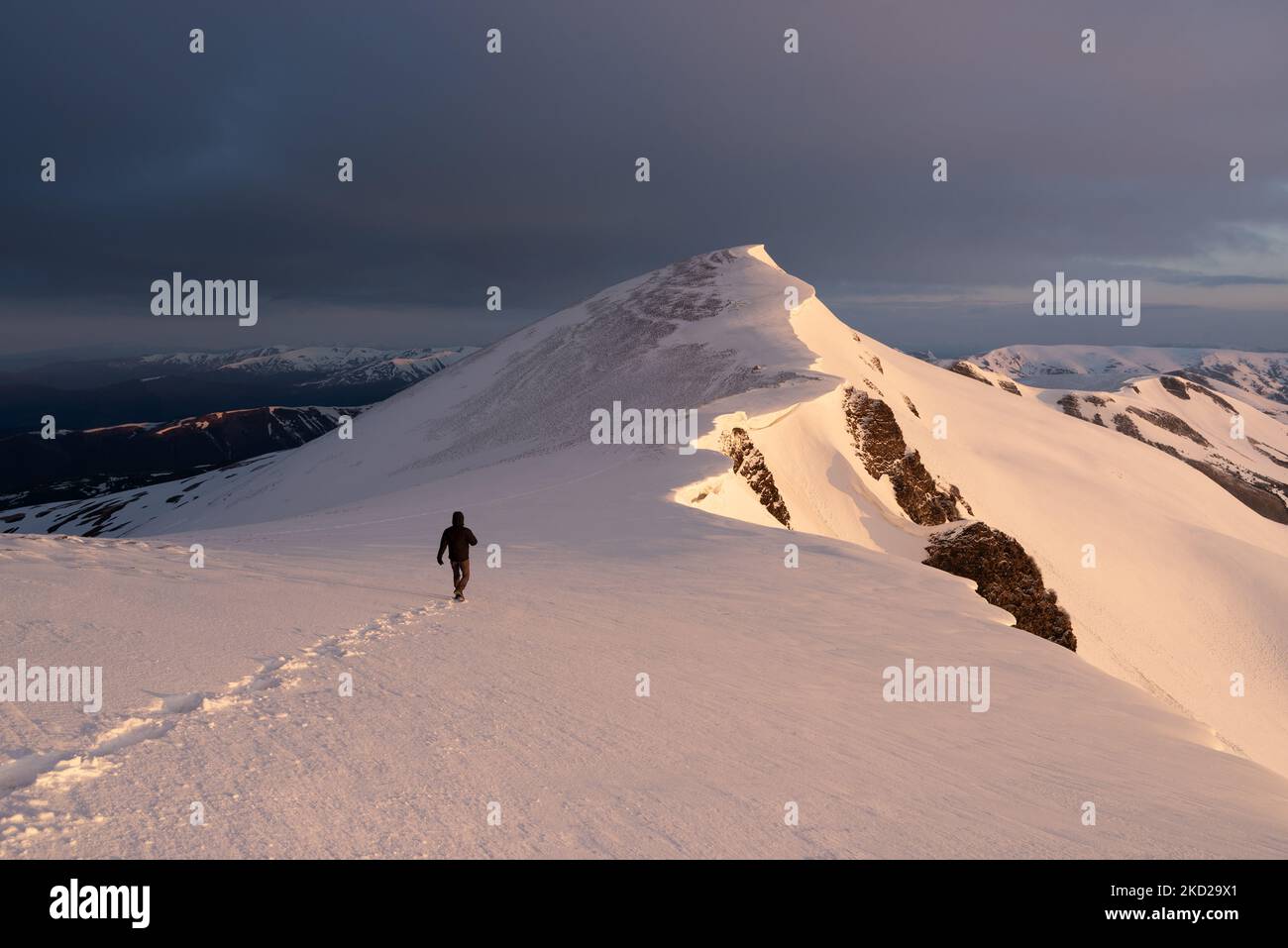Cold weather mountains hiking in snow Stock Photo