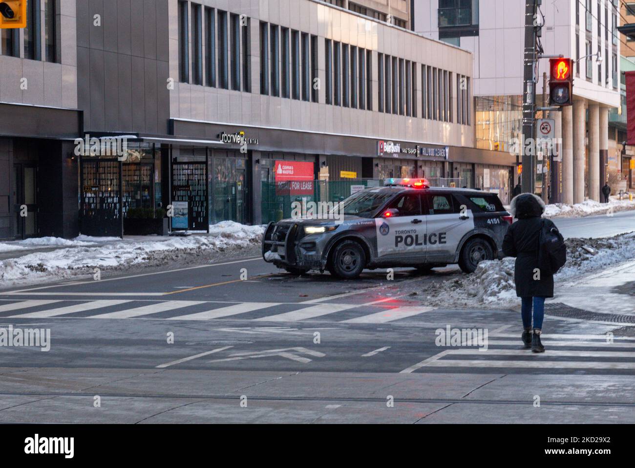 Toronto police block roads near Queen's Park Circle, from College Street to Bloor Street to prevent possible demonstrations involving a large number of vehicles in Downtown Toronto, Canada, on February 5, 2022 (Photo by Anatoliy Cherkasov/NurPhoto) Stock Photo