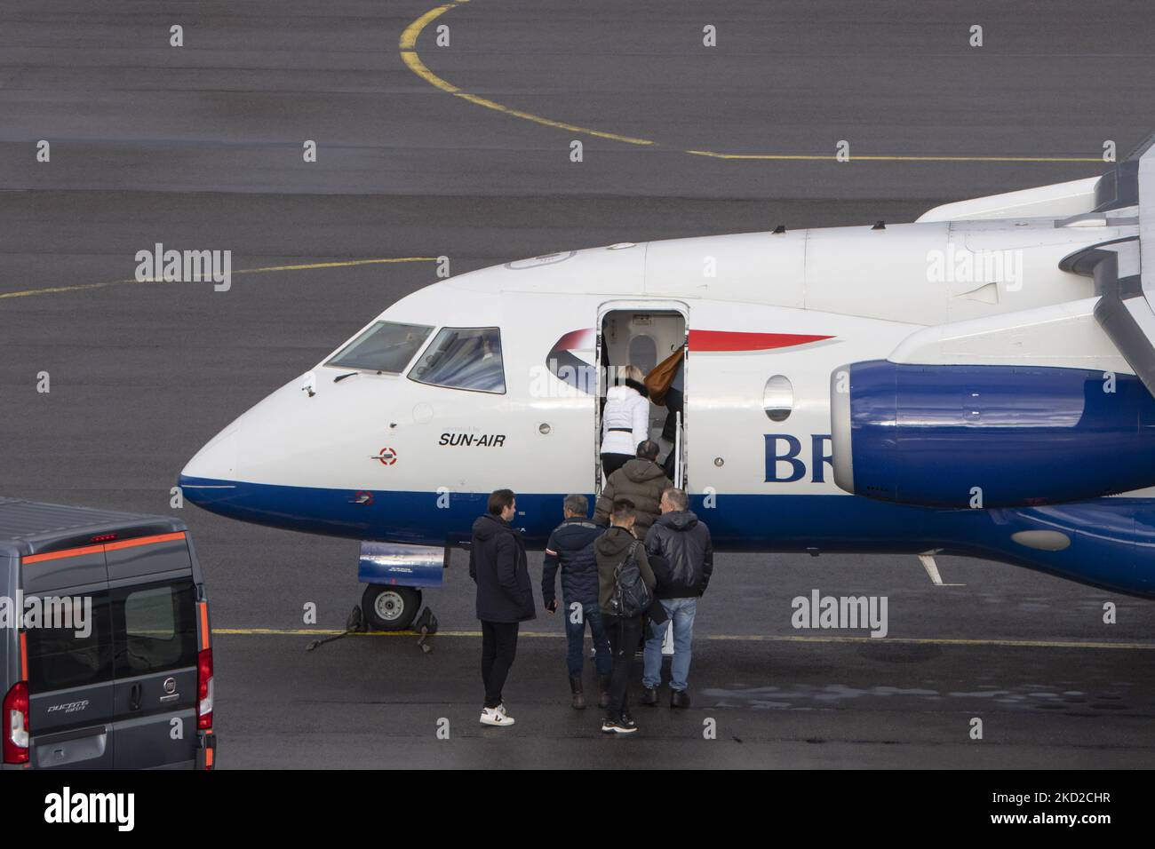 Passenger boarding in the regional airliner. British Airways Dornier Do-328JET-300 aircraft as seen in Eindhoven airport EIN during the taxiing, takeoff, and flying phase departing to Arvidsjaur AJR in Sweden. The Dornier 328 jet edition with registration OY-NCW passenger airplane is a commuter airliner based on the turboprop-powered Dornier 328. SUN-AIR of Scandinavia A/S,[1] usually shortened to SUN-AIR, is a Danish regional airline headquartered in Billund, with its main base at Billund Airport. It operates scheduled services as a franchise of British Airways using their name and corporate  Stock Photo