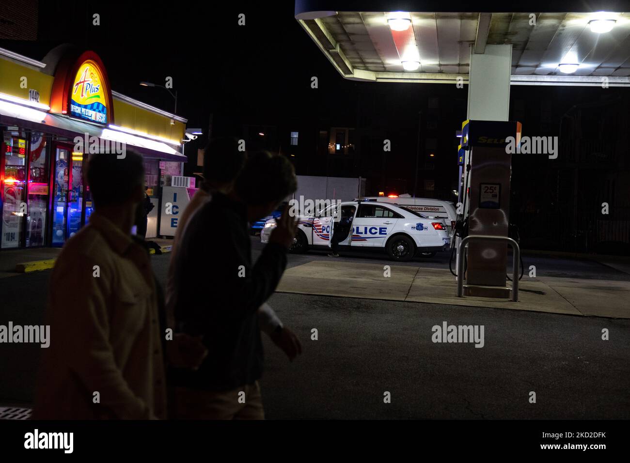 Police respond to a report of a double shooting at a gas station at