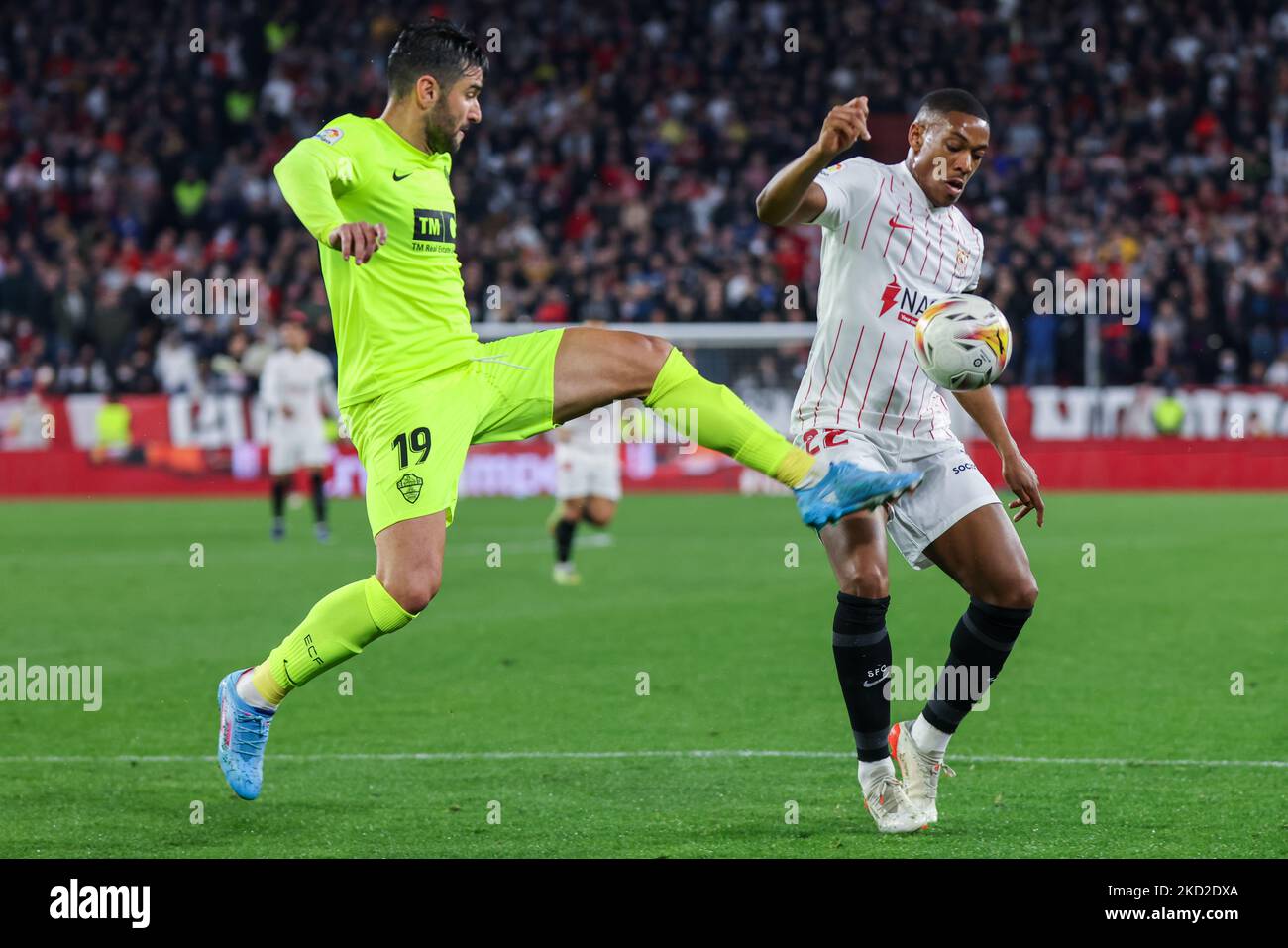 Anthony Martial of Sevilla CF competes for the ball with Antonio Barragan of Elche CF during the La Liga Santader match between Sevilla CF and Elche CF at Ramon Sanchez Pizjuan in Seville, Spain, on February 11, 2022. (Credit: Jose Luis Contreras) (Photo by DAX Images/NurPhoto) Stock Photo