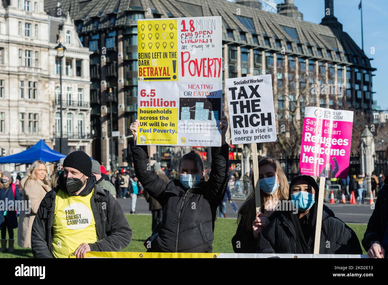 LONDON, UNITED KINGDOM - FEBRUARY 12, 2022: Demonstrators protest in Parliament Square against rising household energy bills, inflation-driven rise in prices and increase in National Insurance contribution amid stagnant wages calling on the government to act to tackle the cost of living crisis on February 12, 2022 in London, England. From April households across the UK will face a significant squeeze on their budgets as the energy price cap will increase by 54% due to global fuel and energy crisis and the National Insurace contribution will rise by 1.25 percent combined with high rates of infl Stock Photo