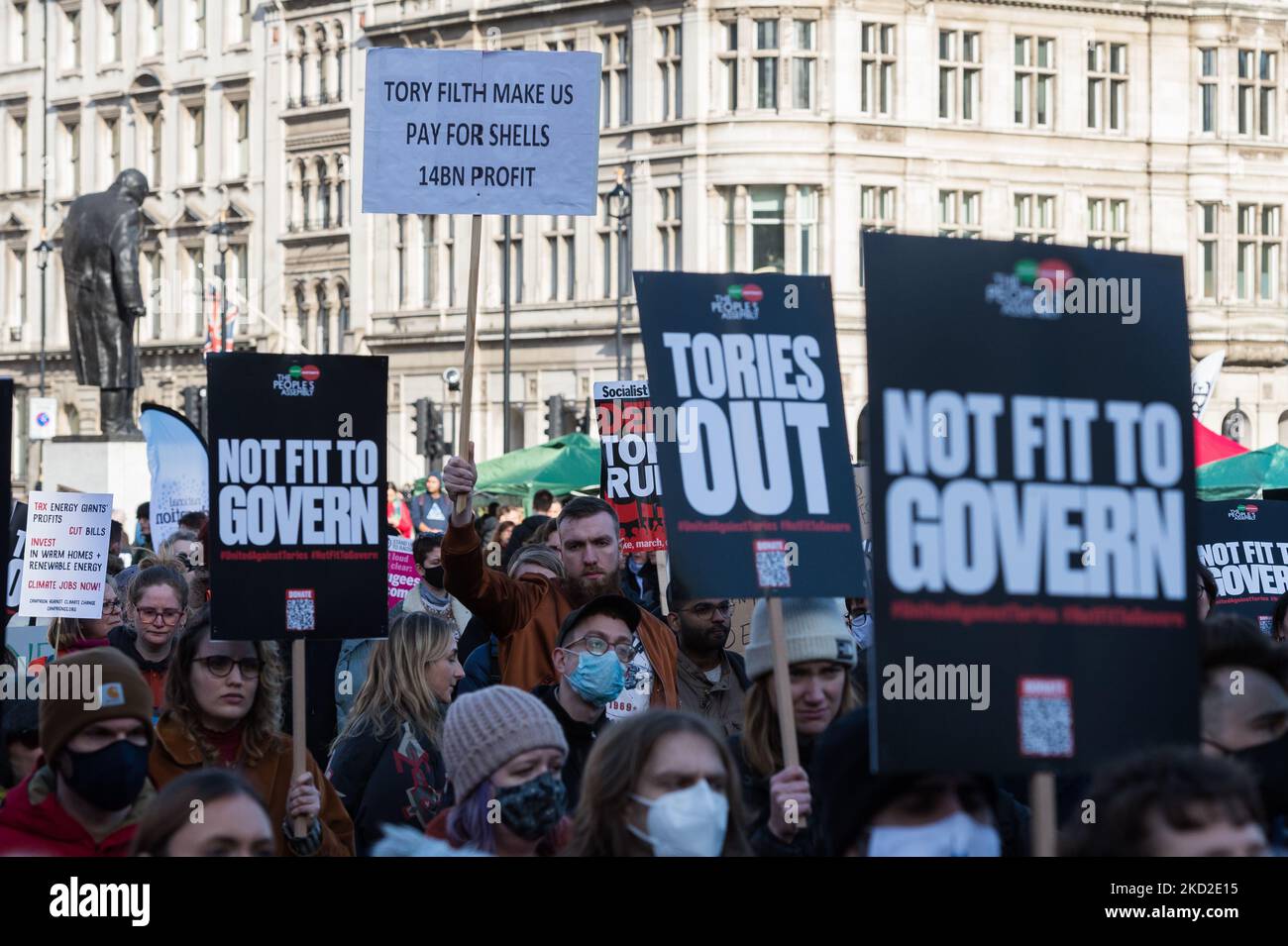 LONDON, UNITED KINGDOM - FEBRUARY 12, 2022: Demonstrators protest in Parliament Square against rising household energy bills, inflation-driven rise in prices and increase in National Insurance contribution amid stagnant wages calling on the government to act to tackle the cost of living crisis on February 12, 2022 in London, England. From April households across the UK will face a significant squeeze on their budgets as the energy price cap will increase by 54% due to global fuel and energy crisis and the National Insurace contribution will rise by 1.25 percent combined with high rates of infl Stock Photo