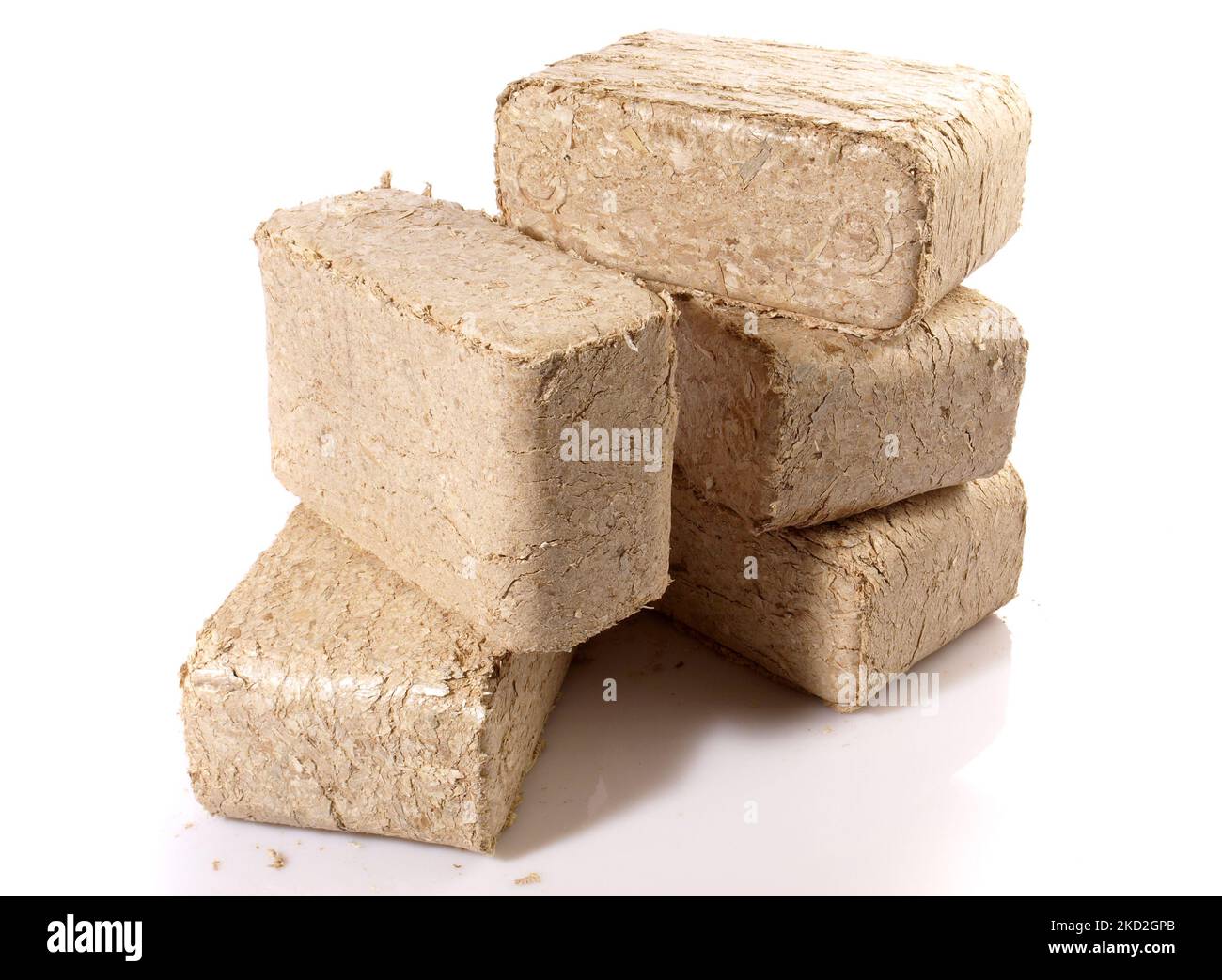 Square Sawdust Briquettes - Compressed Biomass Wood Fire Logs isolated on white Background Stock Photo