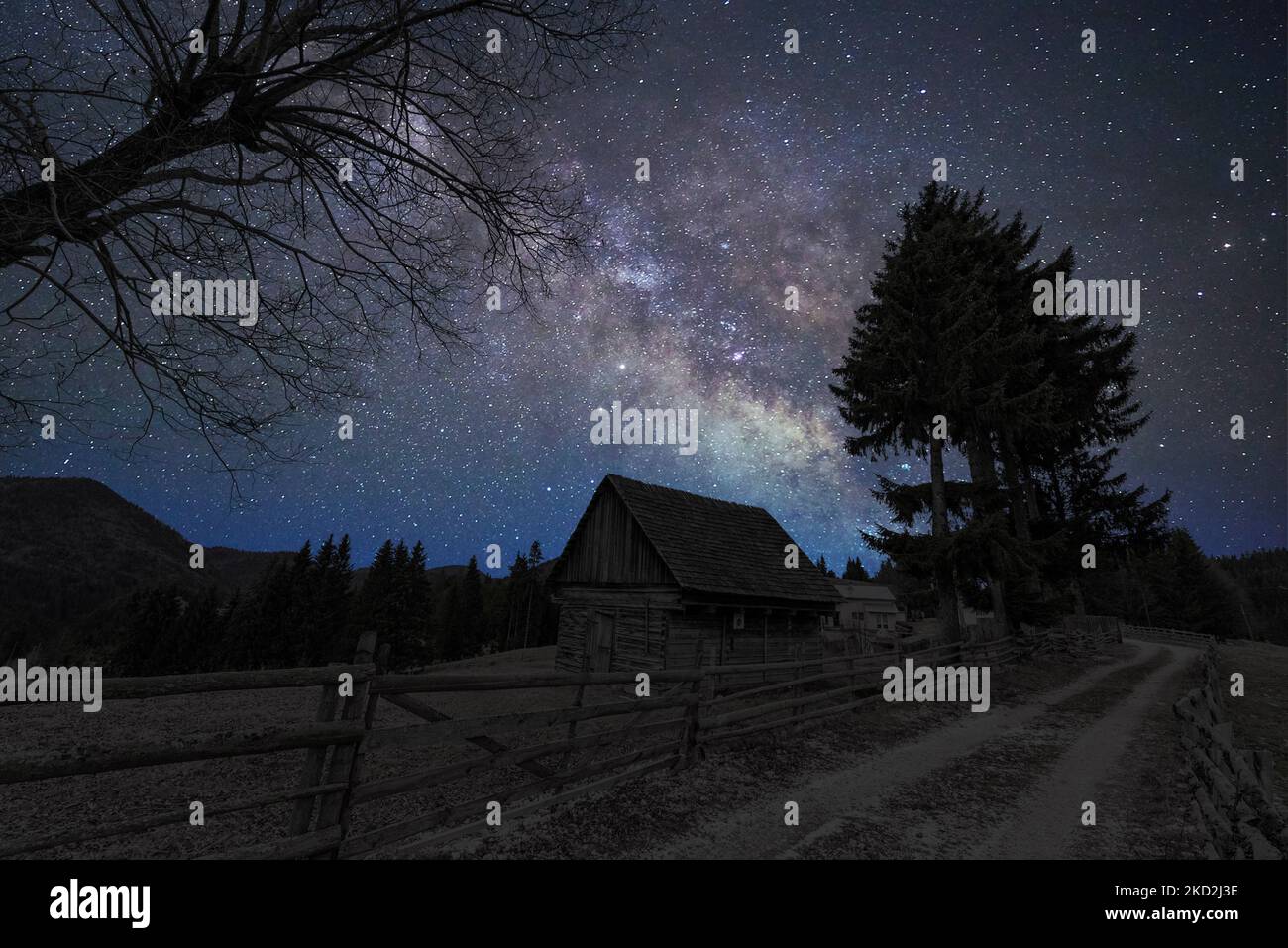 A mesmerizing starry night sky over the rural landscape Stock Photo