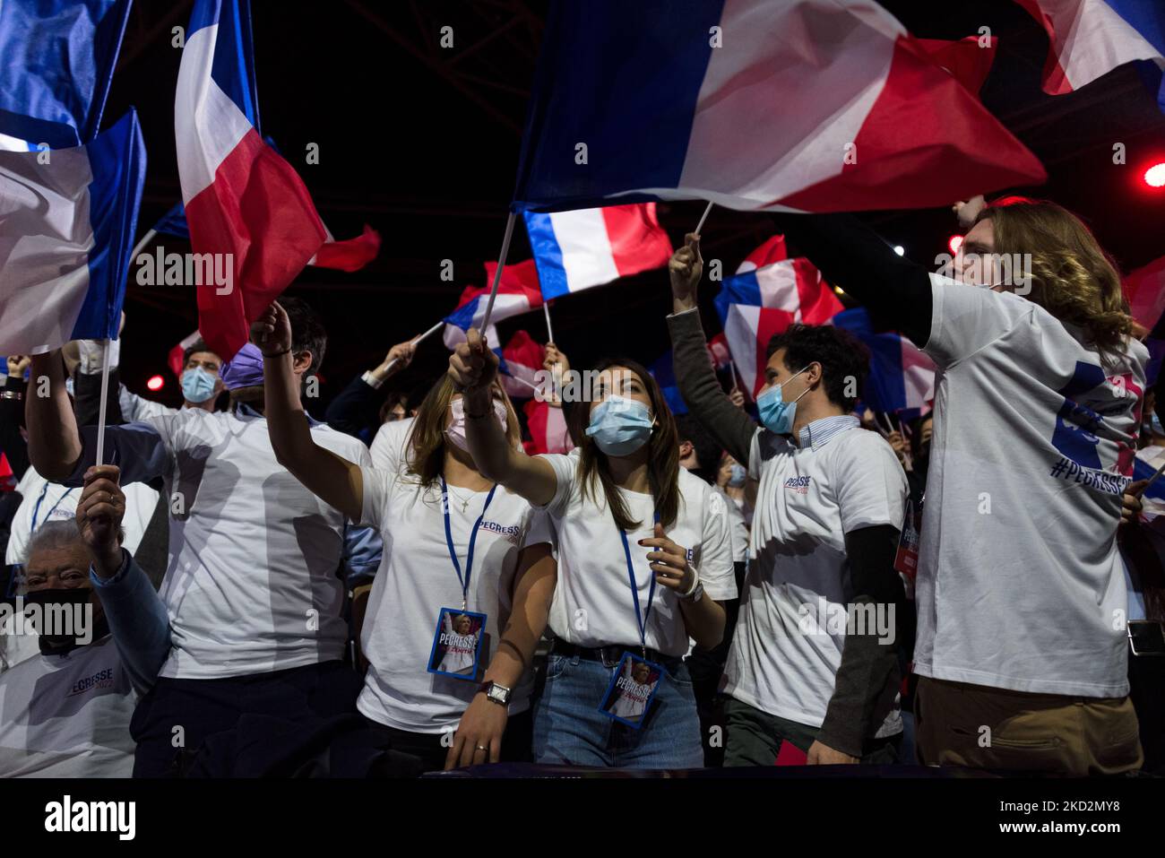 Supporters wave French flags during the meeting of French conservative party Les Républicains (LR) presidential candidate Valerie Pecresse at the Zenith in Paris, in Paris, on Feb. 13, 2022, ahead of the French presidential election in April 2022. (Photo by Samuel Boivin/NurPhoto) Stock Photo