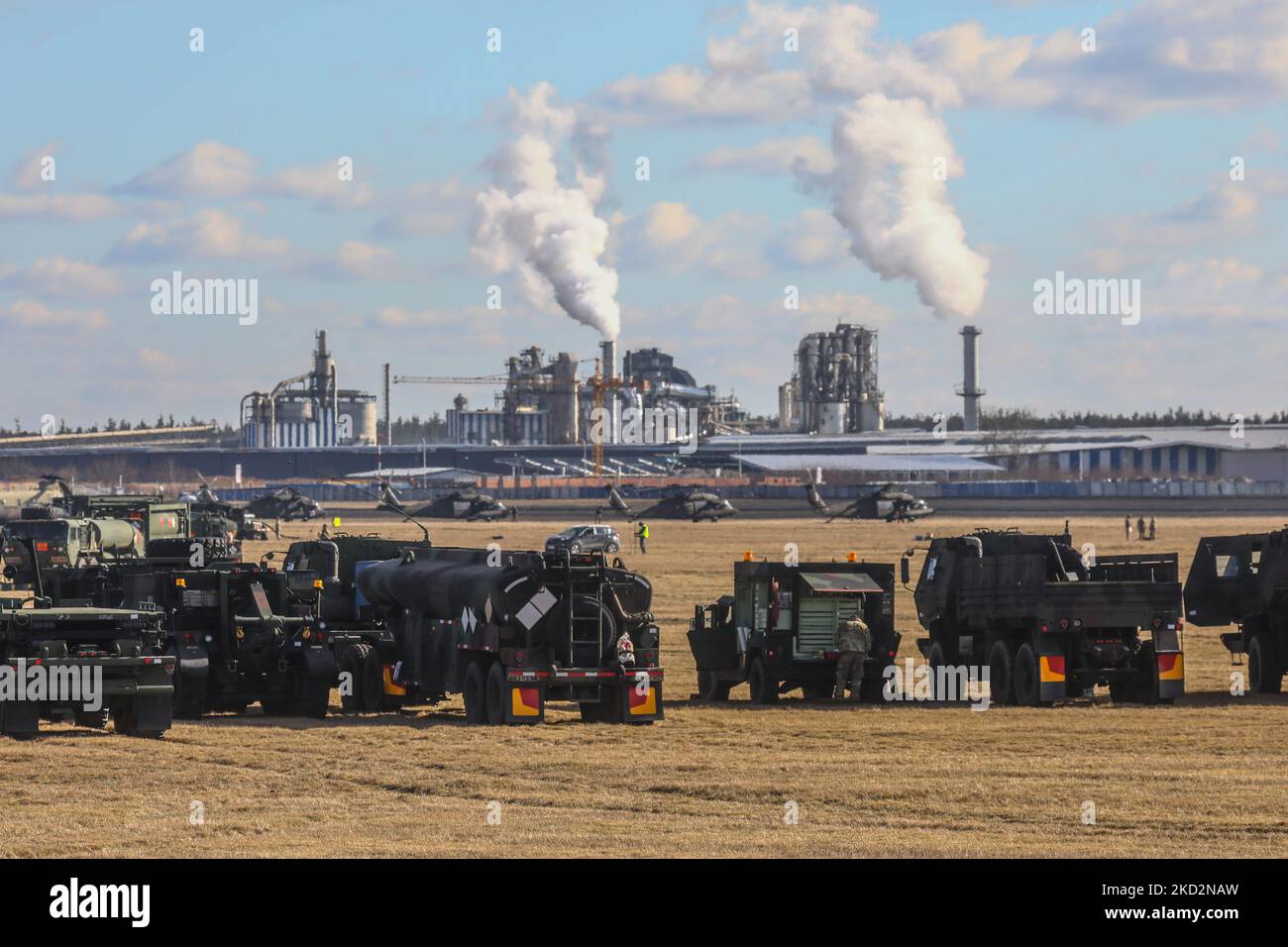 U.S. military vehicles are seen at the military base for U.S. troops which being established at the Mielec Airport. Mielec, Poland on February 12, 2022. U.S. troops have arrived as reinforcements for its various NATO allies in Eastern Europe, including Poland, as fears grow of a possible Russian invasion of Ukraine (Photo by Beata Zawrzel/NurPhoto) Stock Photo