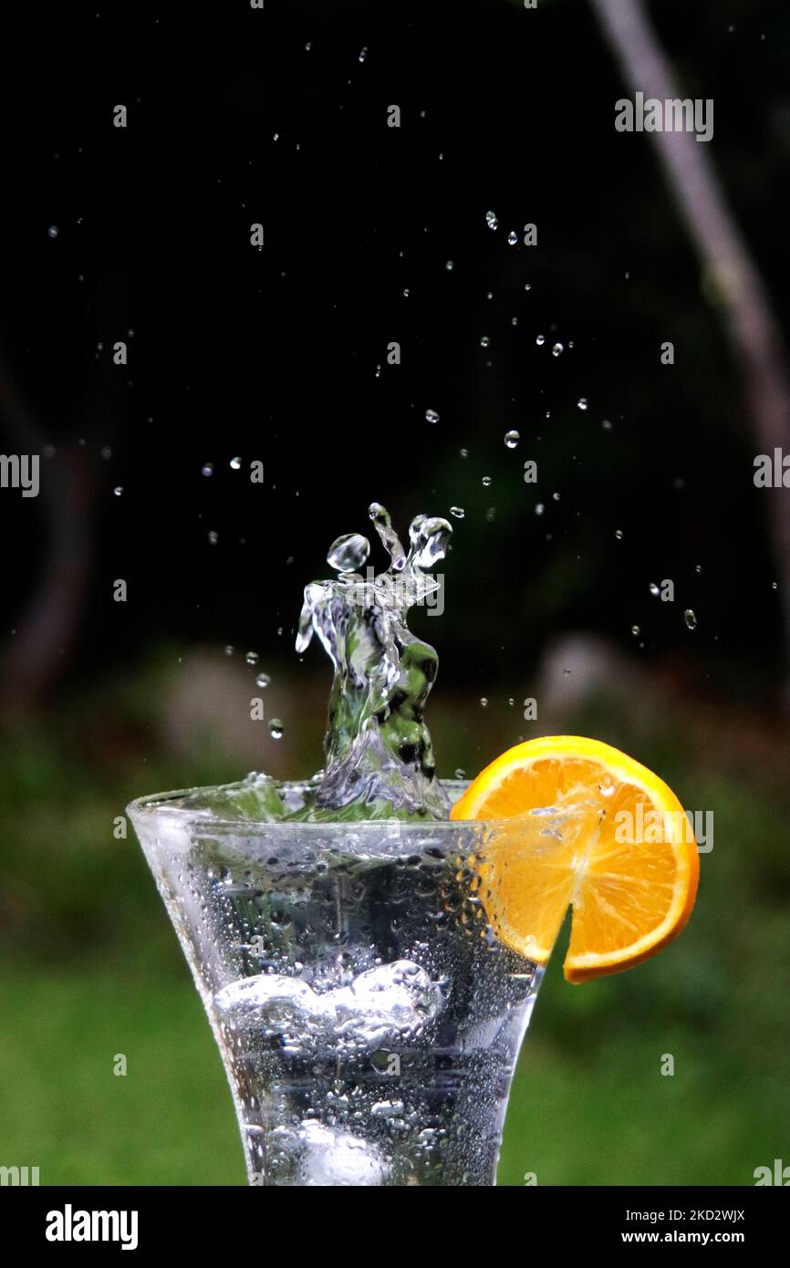 Orange liquid splash crown hi-res stock photography and images - Alamy
