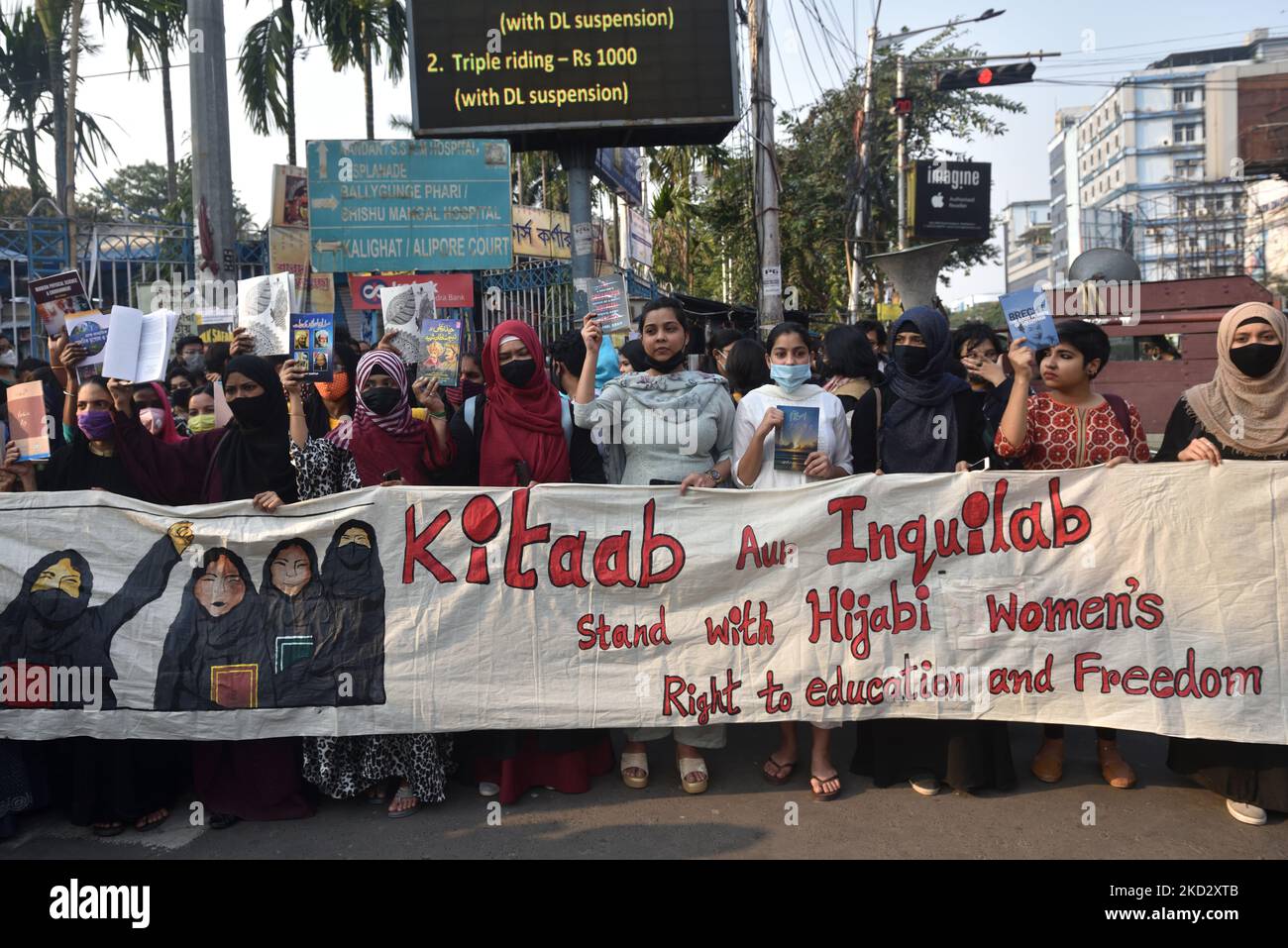 Activists hold placards and march during a demonstration in Kolkata, on 16 February 2022 after students at government-run high schools in India's Karnataka state were told not to wear hijabs to class. (Photo by Sukhomoy Sen/NurPhoto) Stock Photo