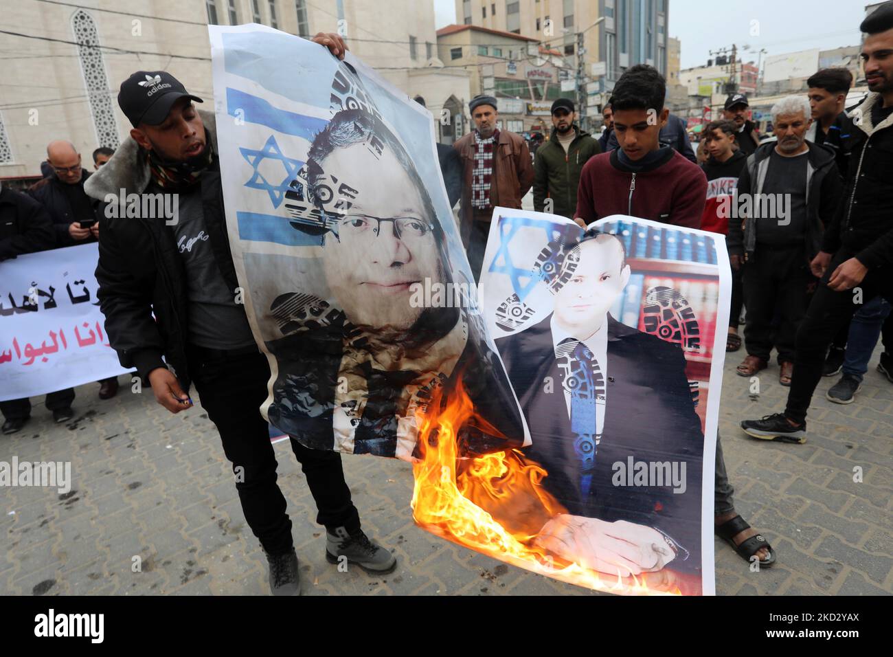 Palestinians burn pictures of Israeli Prime Minister Naftali Bennett and Itamar Ben-Gvir, member of Israel's Knesset (parliament) during a protest in solidarity with east Jerusalem neighbourhood of Sheikh Jarrah, in Khan Younis in the southern Gaza Strip on Feb. 17, 2022. Dozens of families in Sheikh Jarrah are facing displacement from their homes in coordinated efforts by the Israeli government and Jewish settler groups. (Photo by Majdi Fathi/NurPhoto) Stock Photo
