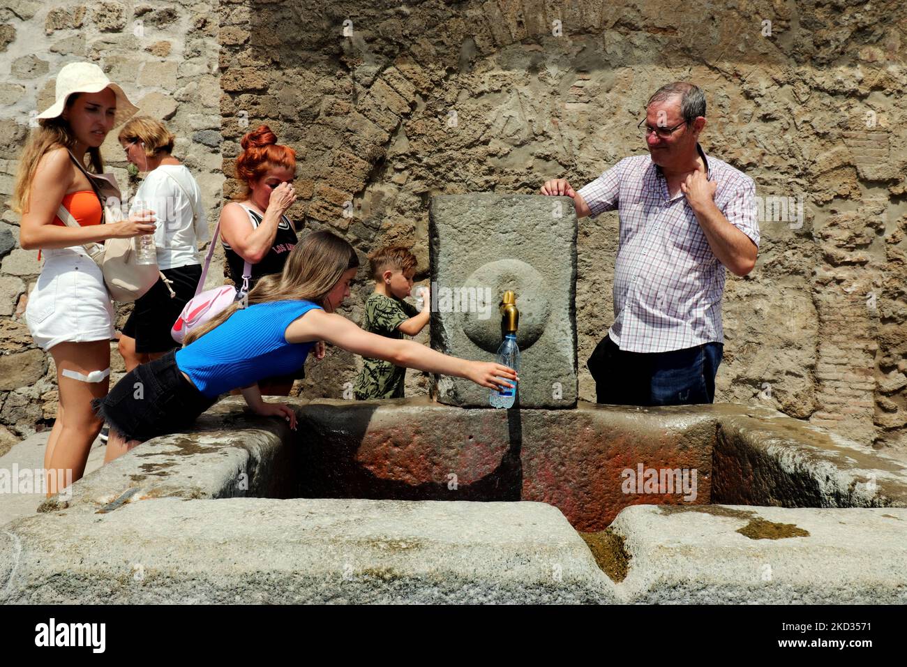 Thirsty tourists in Pompeii, Italy Stock Photo