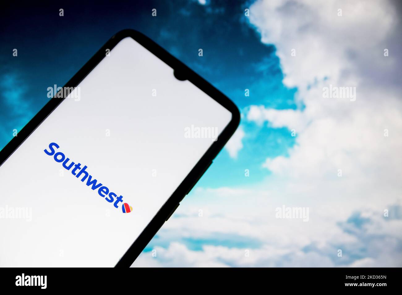 In this photo illustration a Southwest Airlines logo seen displayed on a smartphone screen with a computer wallpaper in the background in Athens, Greece on February 20, 2022. (Photo illustration by Nikolas Kokovlis/NurPhoto) Stock Photo