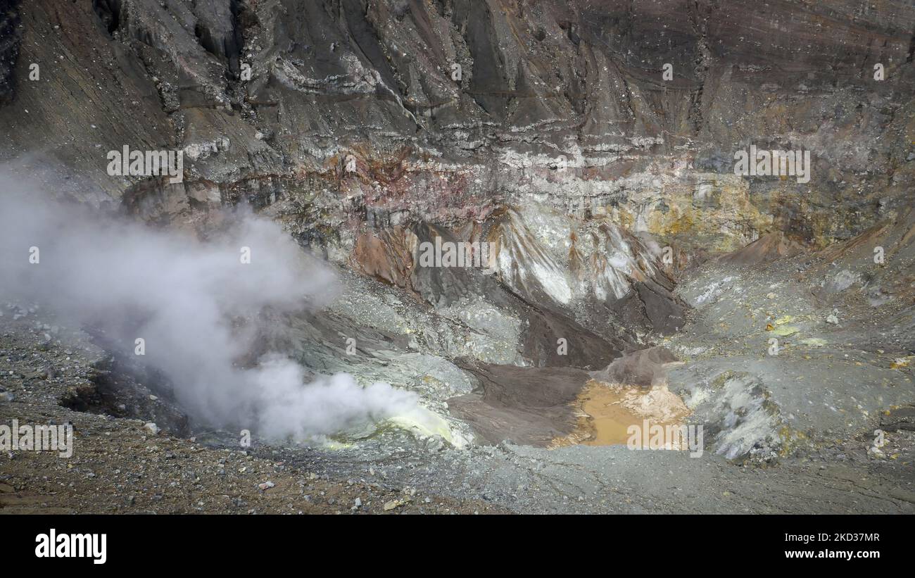Colorful view inside Mount Lokon volcano smoking crater, near Tomohon, North Sulawesi, Indonesia Stock Photo