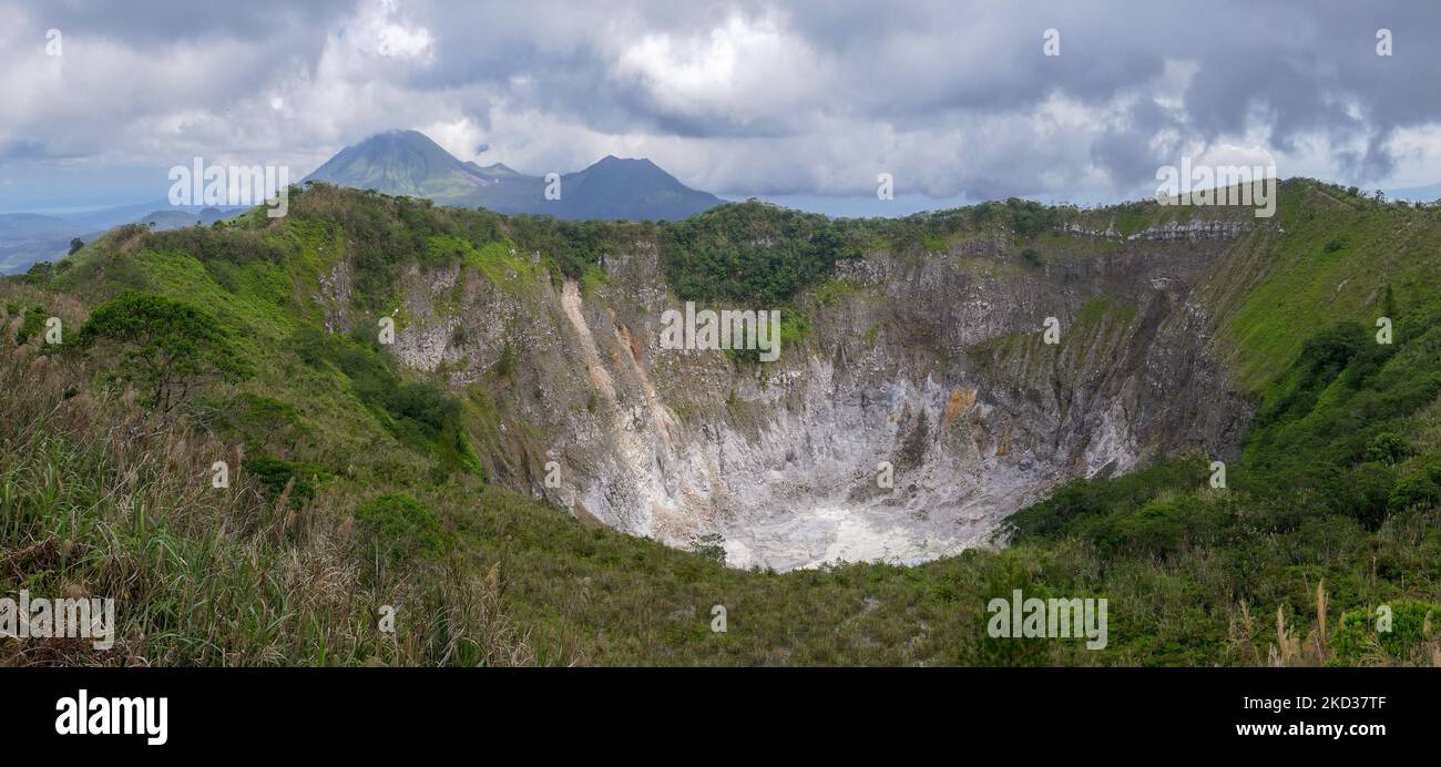 Panoramic view of Mount Mahawu volcano crater, with Mount Lokon in background, near Tomohon, North Sulawesi, Indonesia Stock Photo