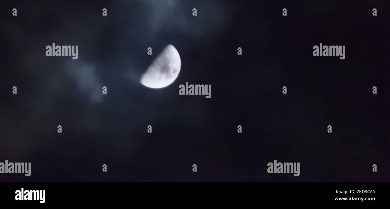 Beautiful moon in the cloudy night sky Stock Photo - Alamy