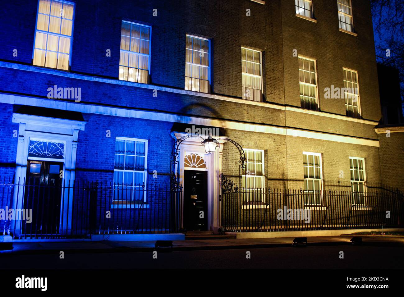 The colours of the Ukrainian flag light the facade of 10 Downing Street in London, England, on February 24, 2022. British Prime Minister Boris Johnson announced this evening that major Russian banks will be excluded from the UK financial system and oligarchs targeted in new sanctions unveiled in response to Russia's invasion of Ukraine. Russia's national airline Aeroflot will also be banned from landing in the UK. (Photo by David Cliff/NurPhoto) Stock Photo