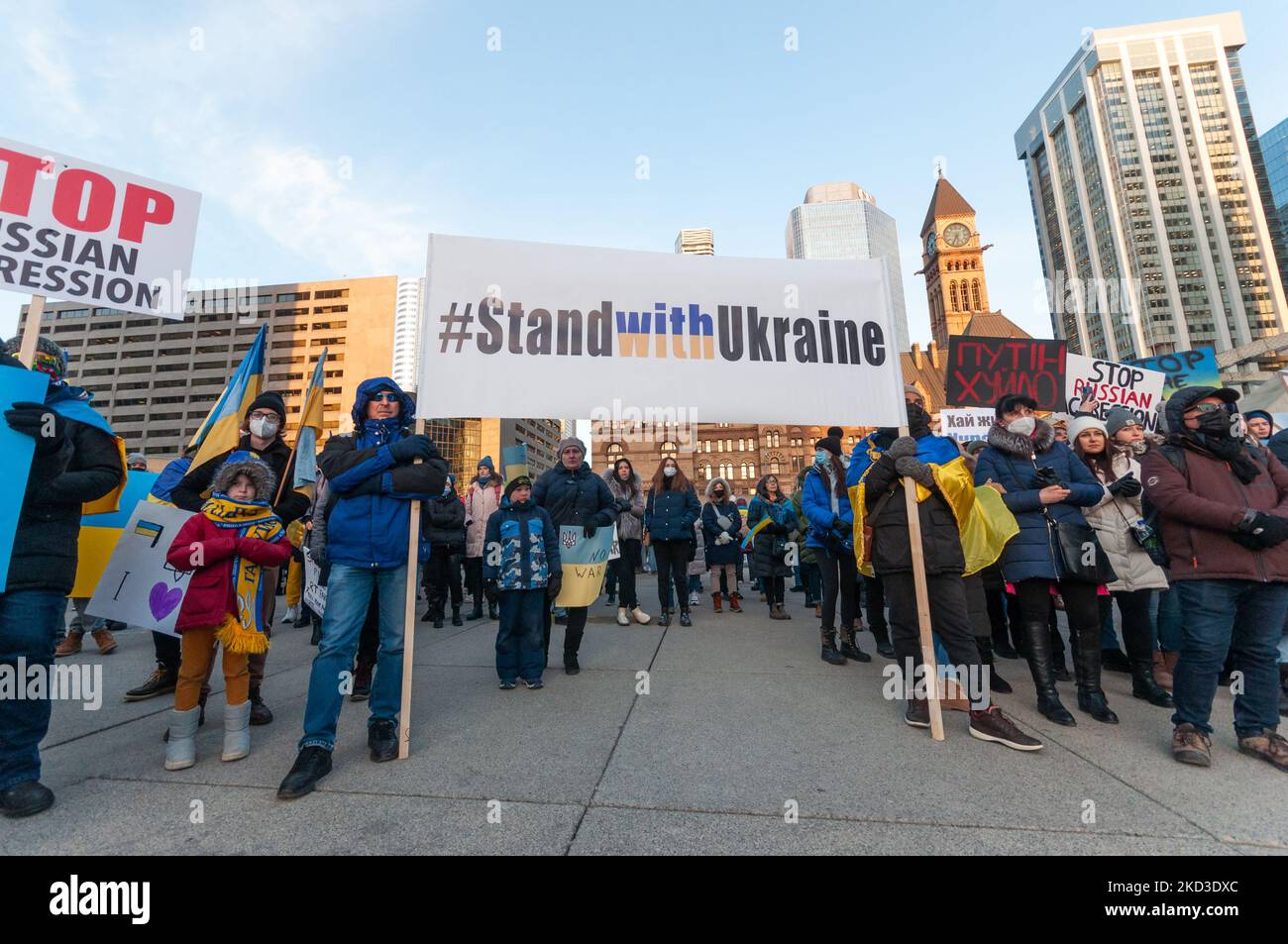 Protestors with banners and Ukrainian flags in Downtown Nathan Phillips Square during a demonstration against the start of the war of Russian aggressors against Ukraine. On February 24, 2022, the beginning of the attack and hostilities on the territory of Ukraine. (Photo by Anatoliy Cherkasov/NurPhoto) Stock Photo