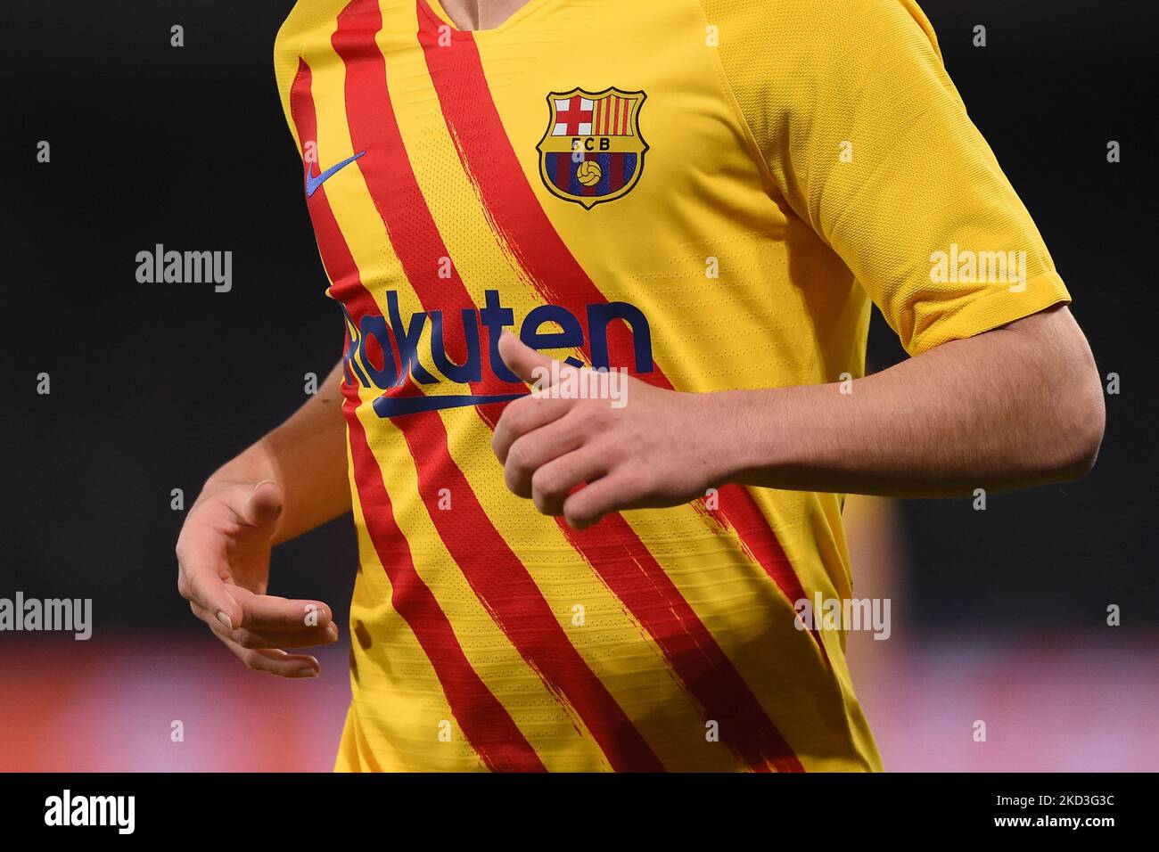 FCB FC Barcelona logo badge on orange coloured football shirt Stock Photo -  Alamy