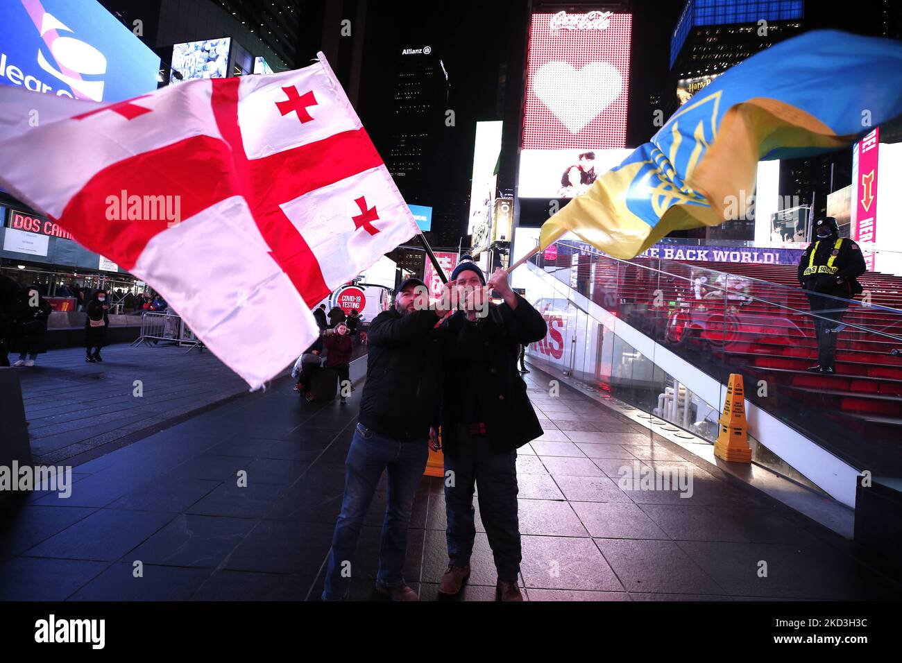 Ukraine supporters rally in Times Square holding flags, signs and chanting slogans on February 25, 2022 in New York City. People form Azerbaijan, Georgia and other indo-euroopean supporters gathered in solidarity against Russian President Vladimir Putin one day after he ordered the invasion of Ukraine. (Photo by John Lamparski/NurPhoto) Stock Photo