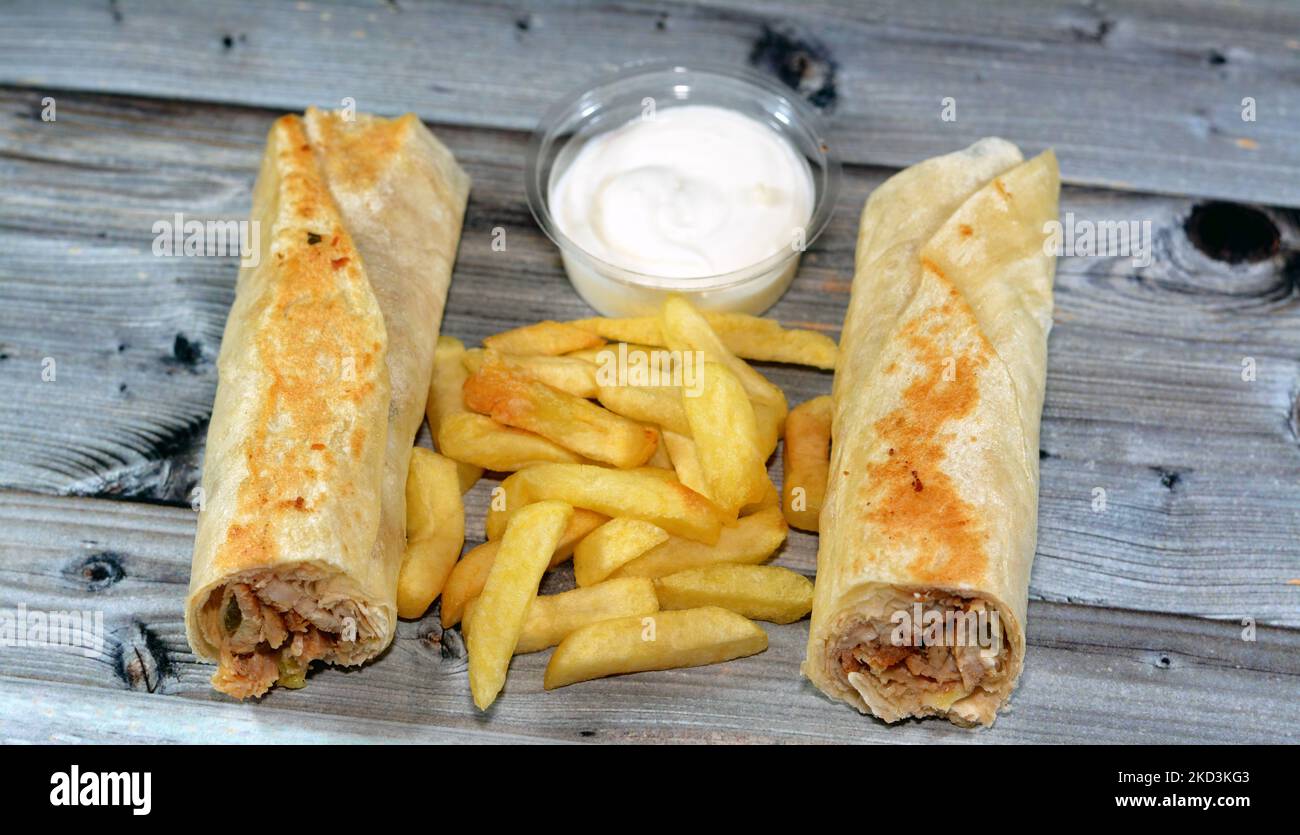 Syrian recipe cuisine background, chicken shawerma or shawarma tortilla