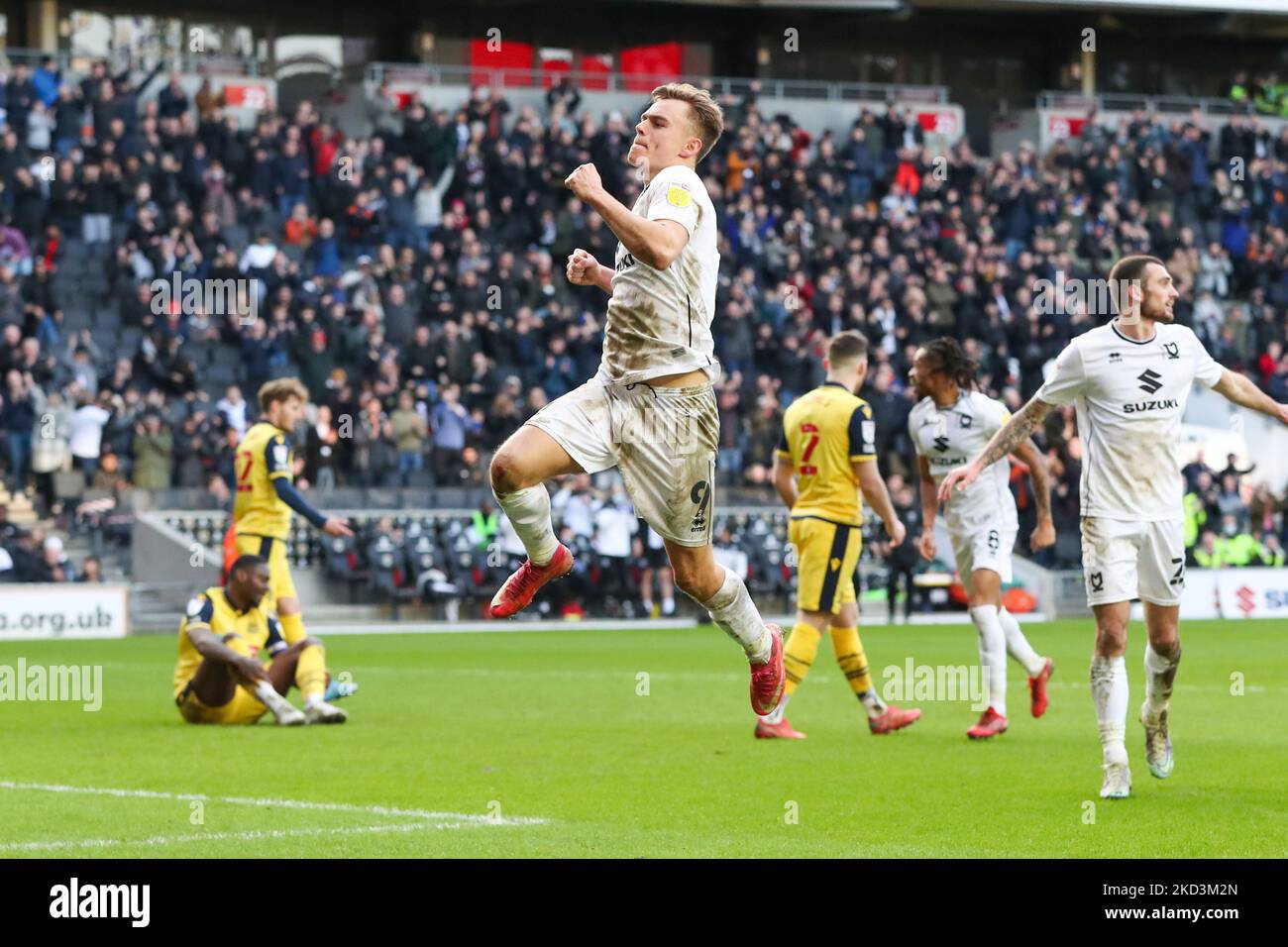 Scott Twine celebrates after scoring for Milton Keynes Dons, to extend