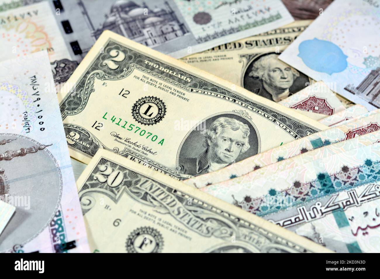 Pile of Egyptian and American money currency banknotes of 1, 2 and 20