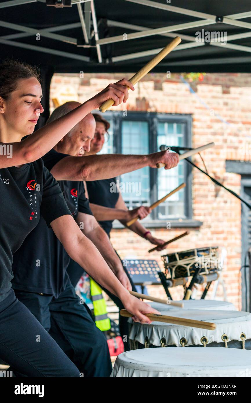 The English Kensei Taiko drumming group performing Japanese drumming on