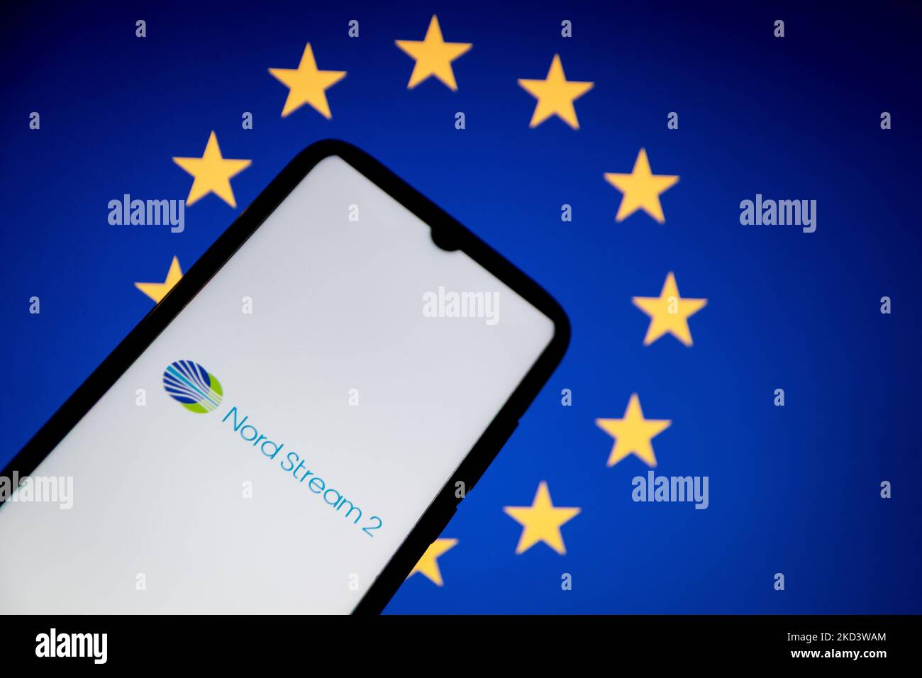 In this photo illustration a North Steam 2 logo seen displayed on a smartphone screen with a flag of European Union in the background in Athens, Greece on February 28, 2022. (Photo illustration by Nikolas Kokovlis/NurPhoto) Stock Photo