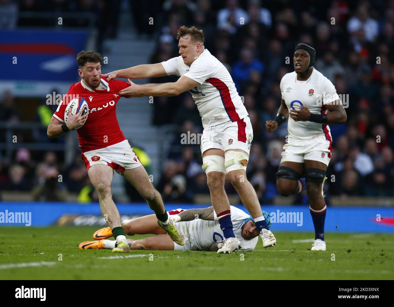 Alex Cuthbert of Wales makes his 50th cap for Wales gets tackled by Alex Dombrandt of England during Guinness six Nations match between England and Wales, at Twickenham Stadium on 26th February,