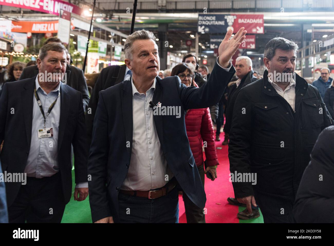 Fabien Roussel, French Communist Party (PCF) presidential candidate, walks in the aisles during the traditional visit of the presidential candidates to the International Agricultural Show currently held at the Parc des Exposition de la Porte de Versailles in Paris on February 28, 2022. (Photo by Samuel Boivin/NurPhoto) Stock Photo