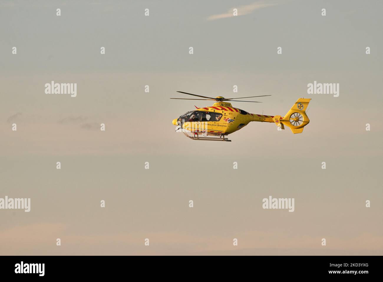 A helicopter from the Norwegian Air Ambulance comes in for landing near Stavanger University Hospital. Stock Photo