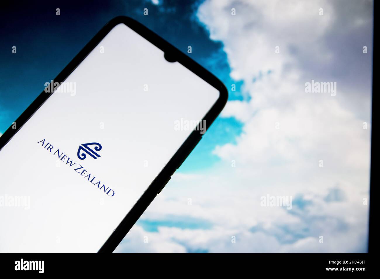 In this photo illustration an Air New Zealand airlines logo seen displayed on a smartphone screen with a computer wallpaper in the background in Athens, Greece on March 2, 2022. (Photo Illustration by Nikolas Kokovlis/NurPhoto) Stock Photo