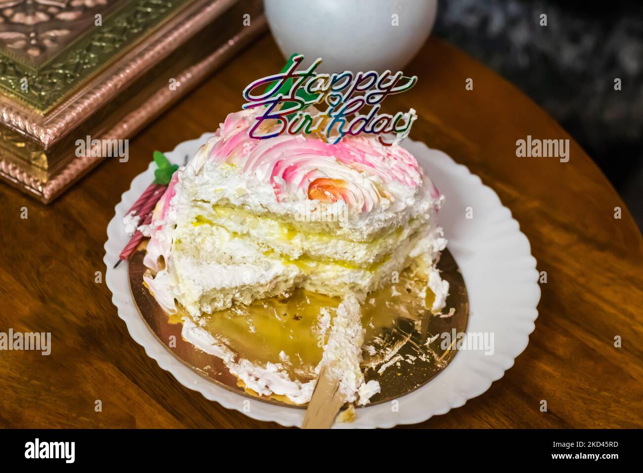 sliced birthday pineapple cake from different angle Stock Photo