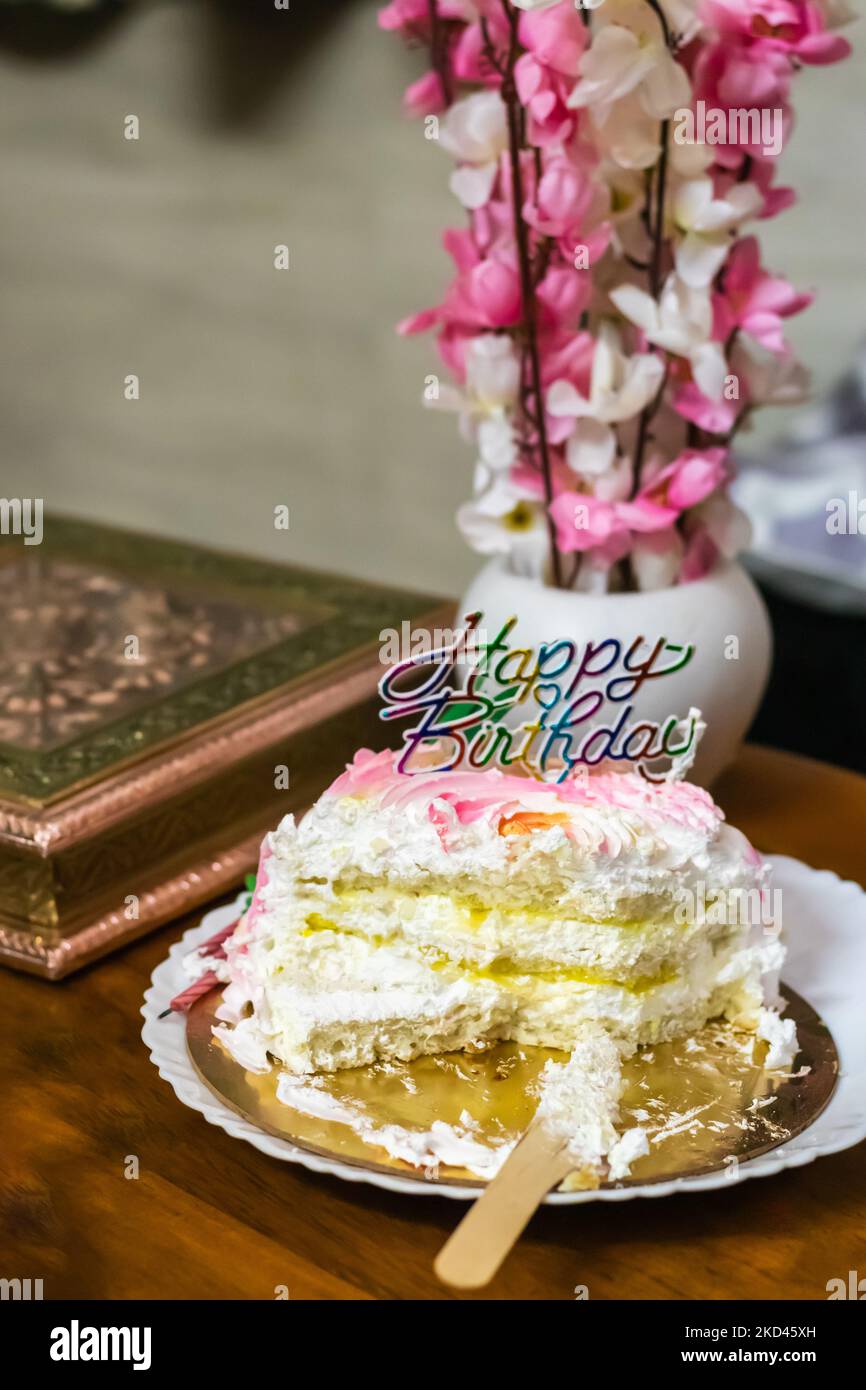 sliced birthday pineapple cake from different angle Stock Photo
