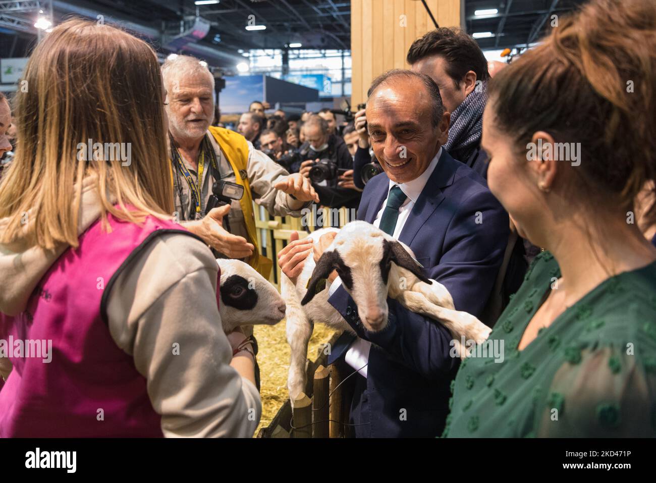 Eric Zemmour, polemical candidate in the French presidential election for the far-right Reconquest (R!) party, carries a lamb in his arms during the traditional walk of the presidential candidates at the International Agricultural Show currently being held at the Parc des expositions de la Porte de Versailles in Paris to meet producers, breeders and the French people on March 4, 2022 (Photo by Samuel Boivin/NurPhoto) Stock Photo