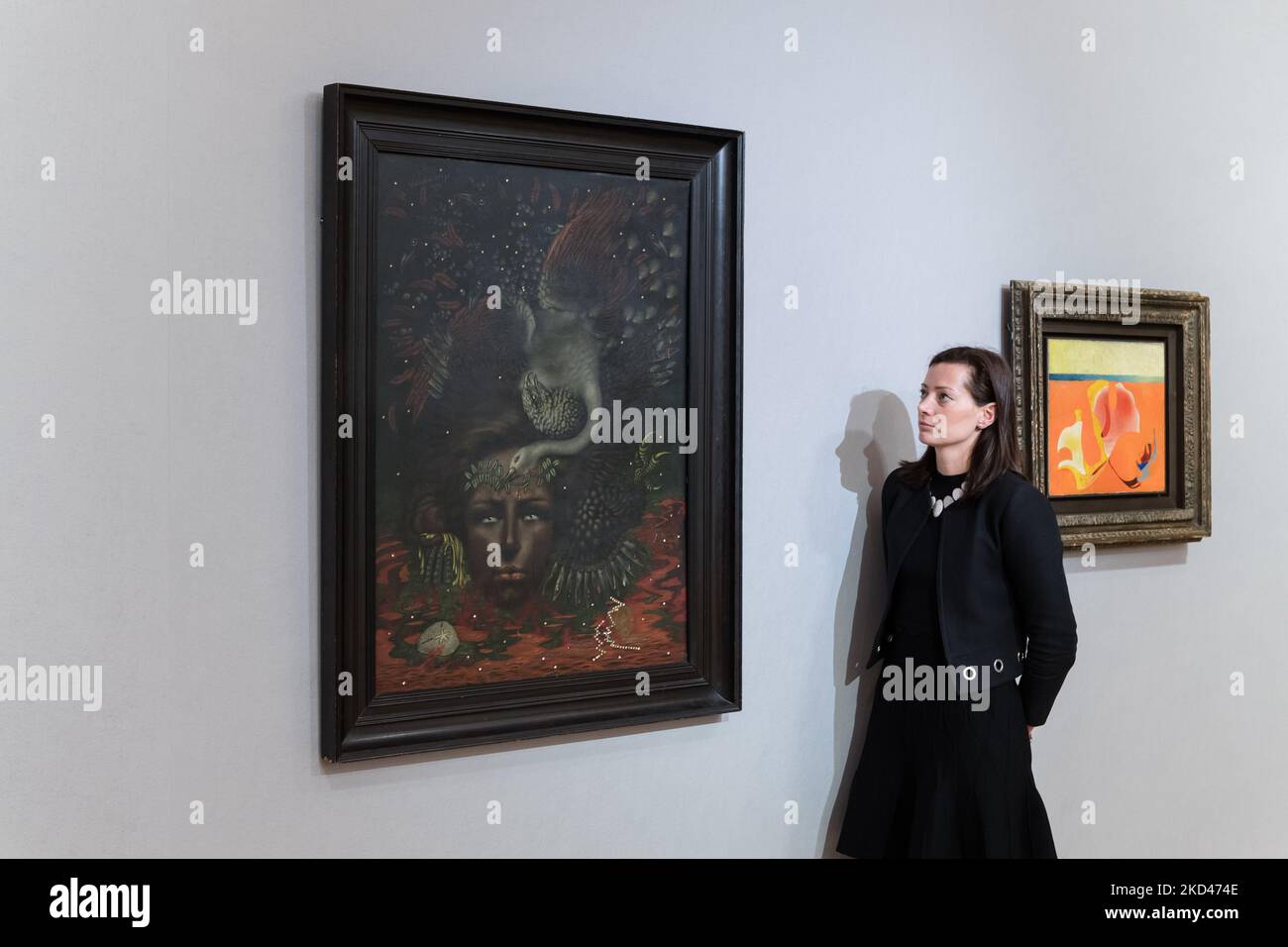 LONDON, UNITED KINGDOM - MARCH 04, 2022: A staff member looks at 'Portrait d'Arthur Rimbaud' (Painted in 1933) by Valentine Hugo (1887-1968), estimate: £400,000 - 600,000 during a photo call for The Mind’s Eye: Surrealist Sale at Bonhams auction house on March 04, 2022 in London, England. (Photo by WIktor Szymanowicz/NurPhoto) Stock Photo