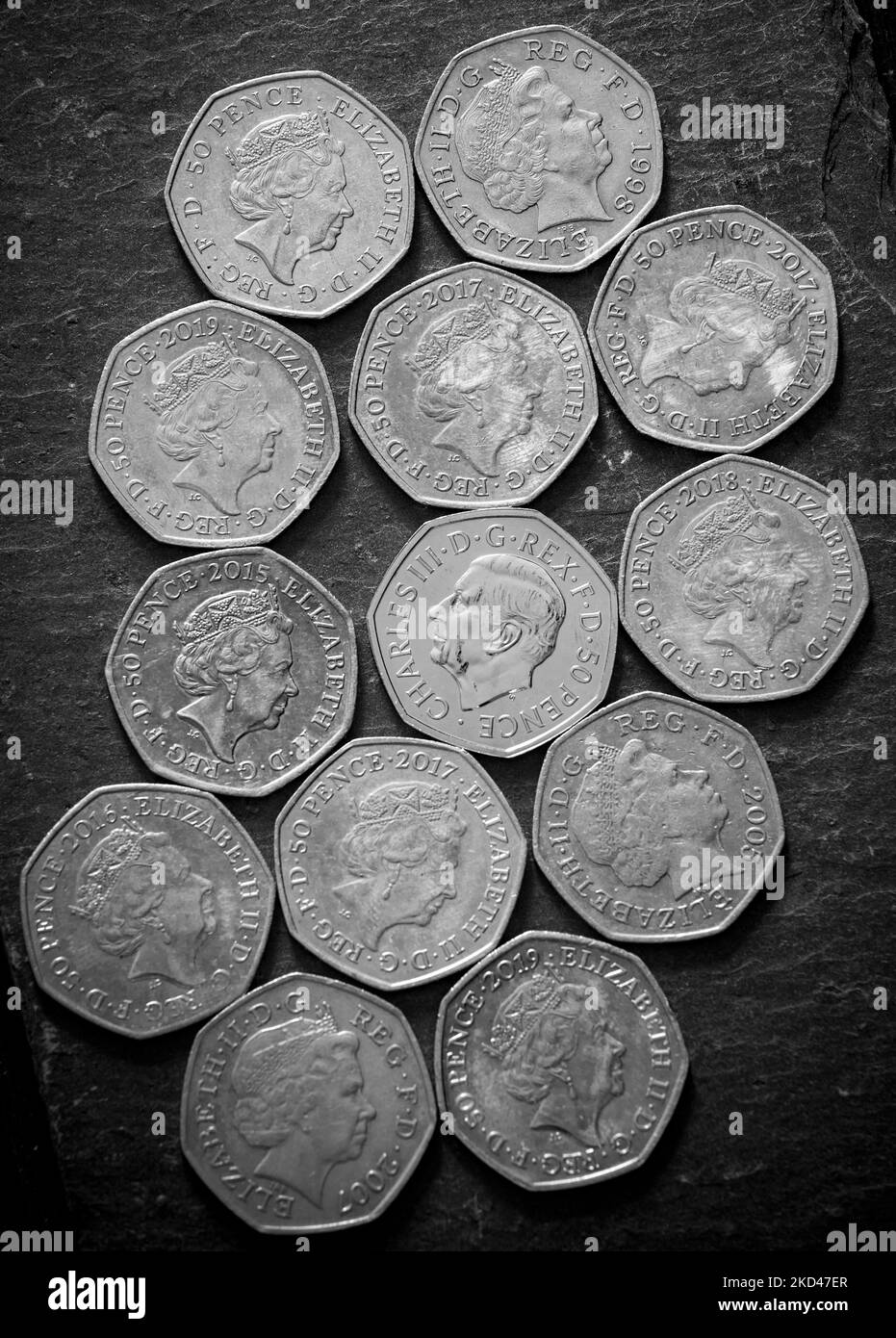 Collection of Fifty pence pieces, including the new Fifty pence piece featuring King Charles III portrait Stock Photo