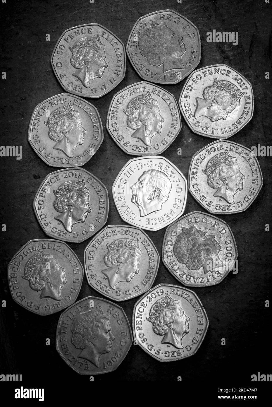 Collection of Fifty pence pieces, including the new Fifty pence piece featuring King Charles III portrait Stock Photo