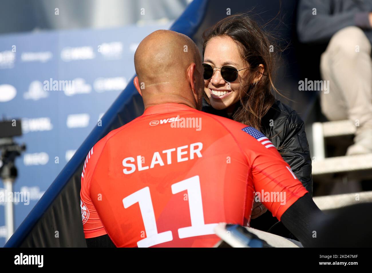 Surfer Kelly Slater of the United States is greeted by his wife Kalani