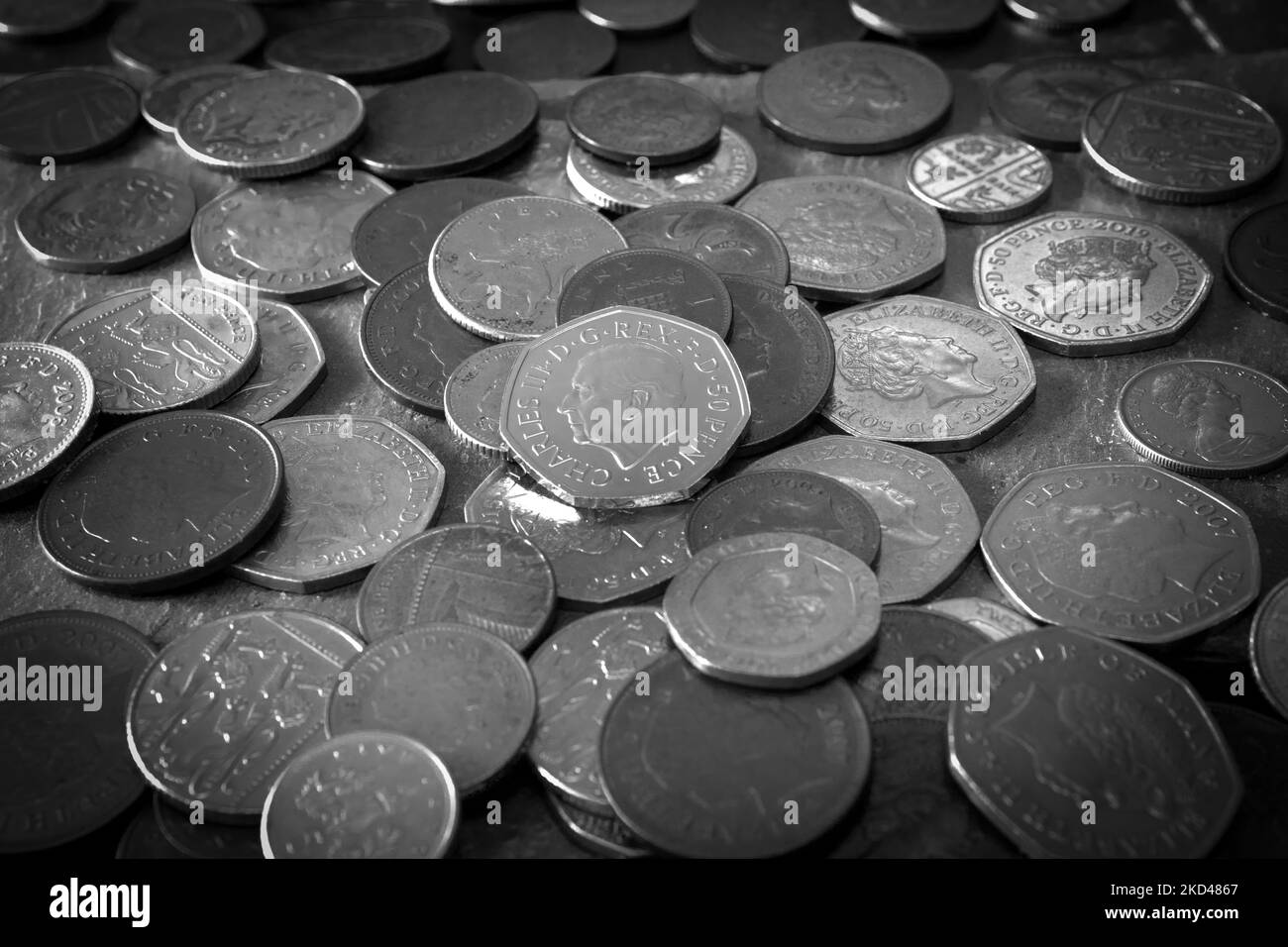 Loose change including the new Fifty pence piece featuring King Charles III portrait Stock Photo